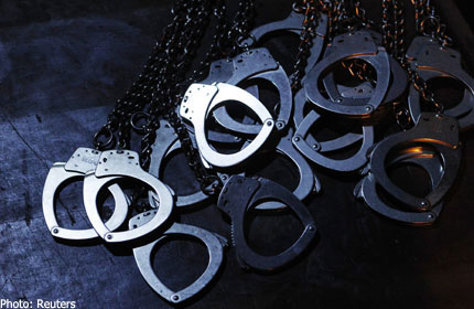 20130109.105021_reuters_handcuffs3.jpg