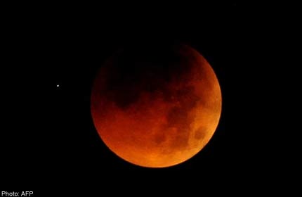 The clouds part and crowd gets a celestial show - Malaysia