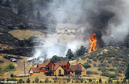 Firefighters battle huge blazes across US West