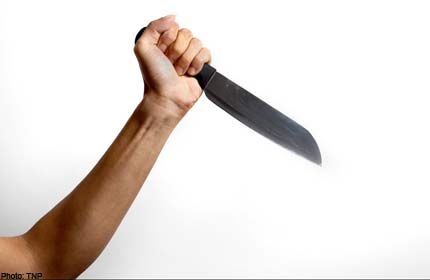 WOMAN CHARGED WITH STABBING MAN