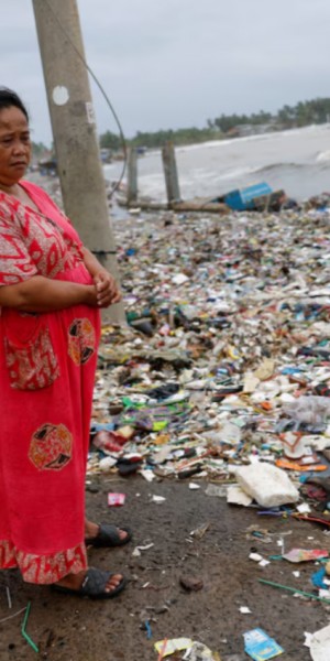 Indonesia fishing village grapples with piles of trash brought in by tides