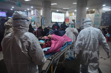 Coronavirus death toll reaches that of Sars as total hits 813 worldwide