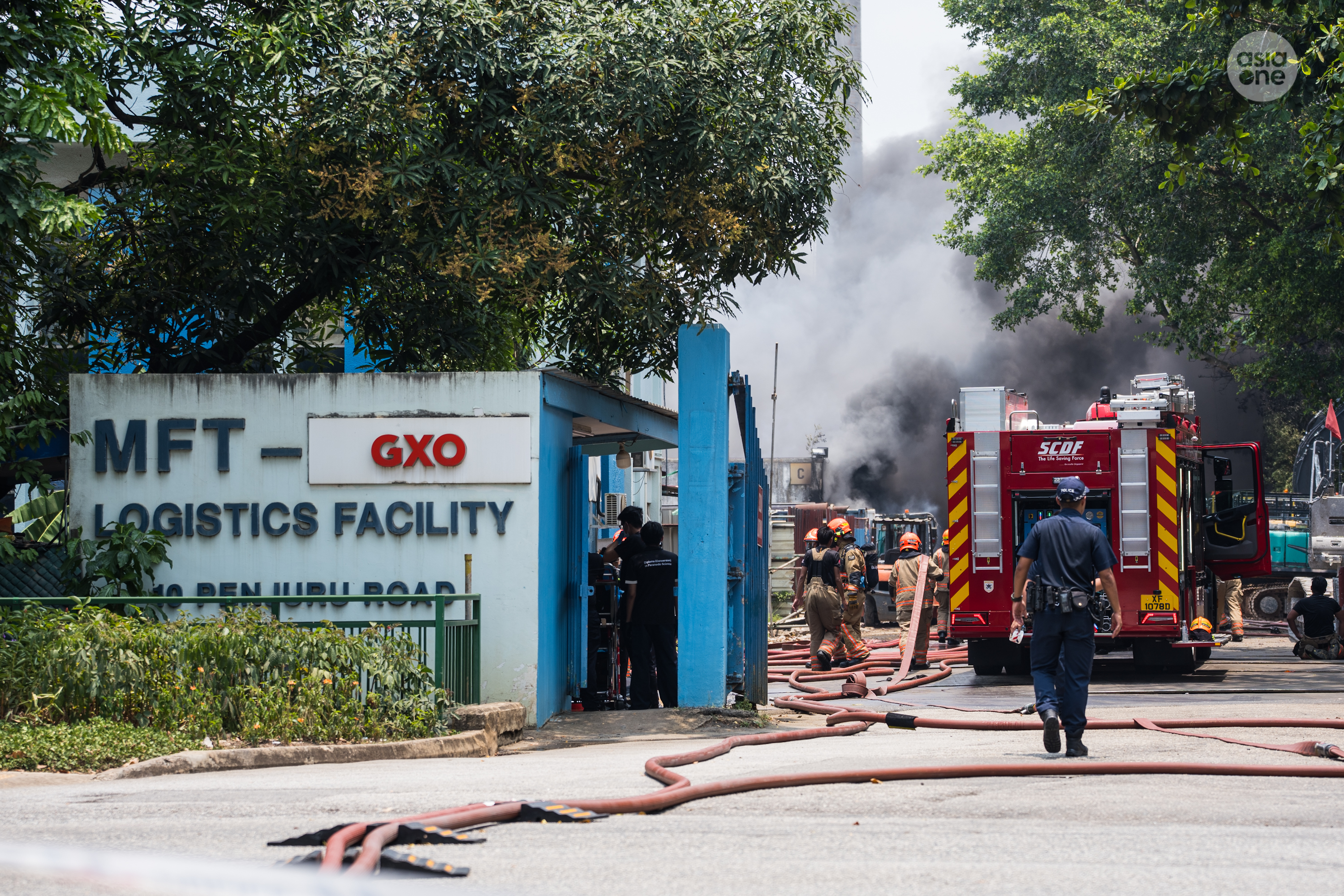 The fire at 10 Penjuru Road involves contents stored within a warehouse.