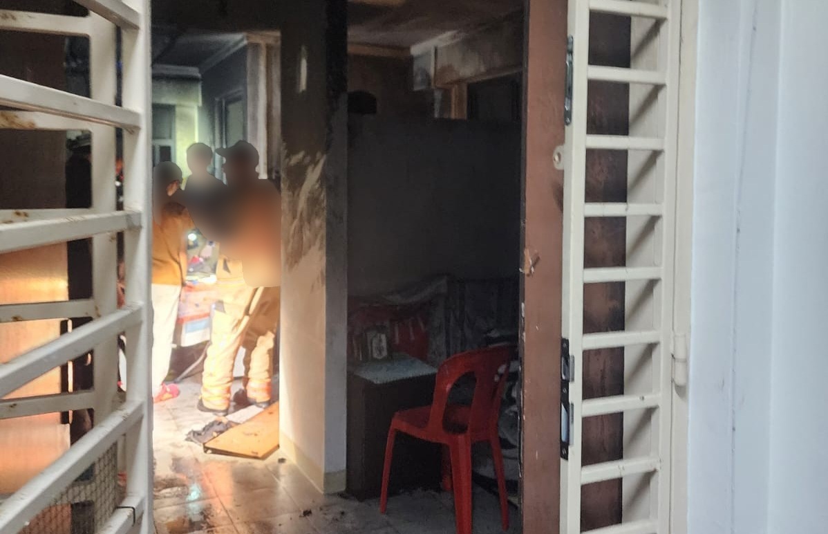 The wooden door of the affected unit showed signs of forced entry.