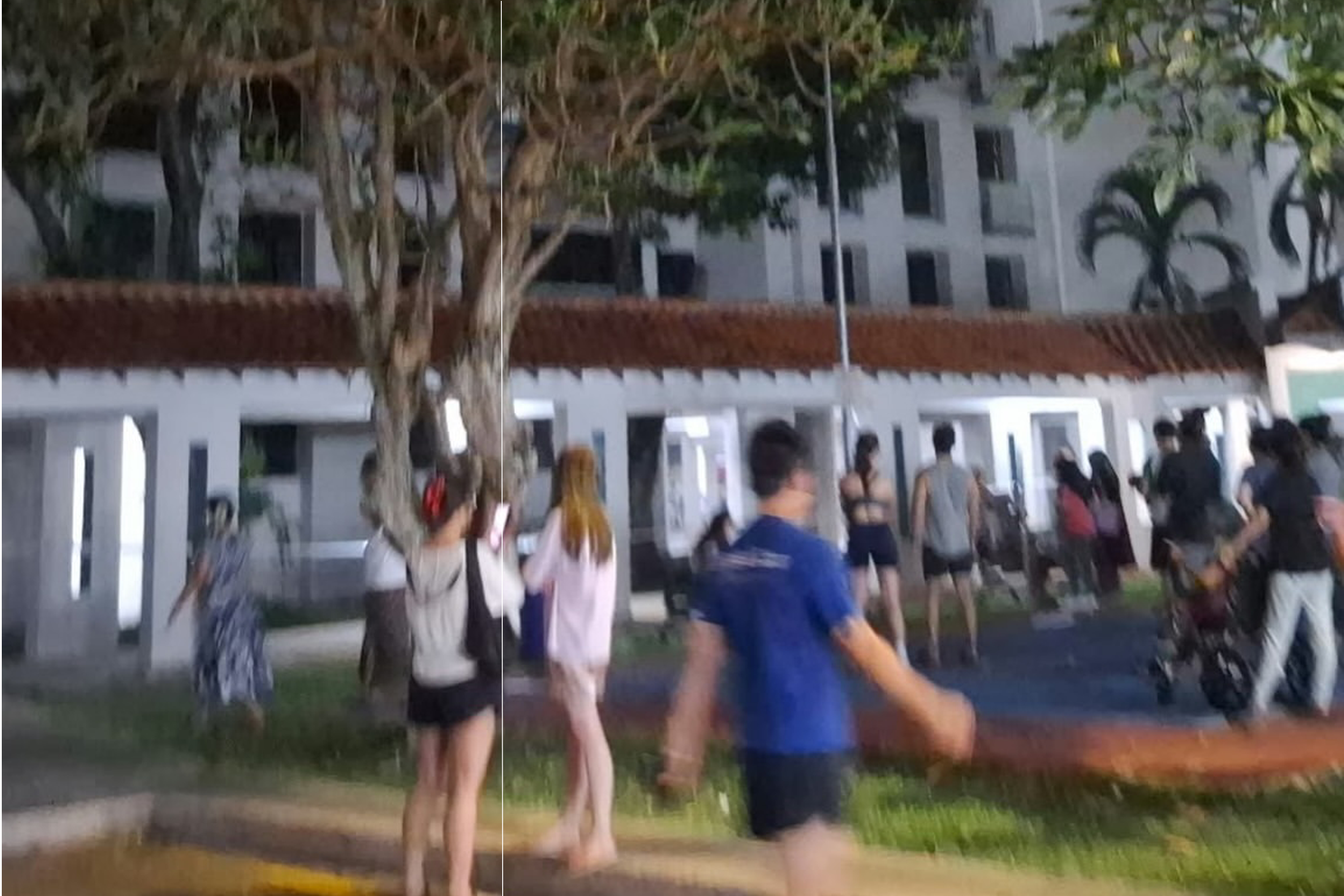 About 50 people who were evacuated from the affected block waiting at the common area beside the block.