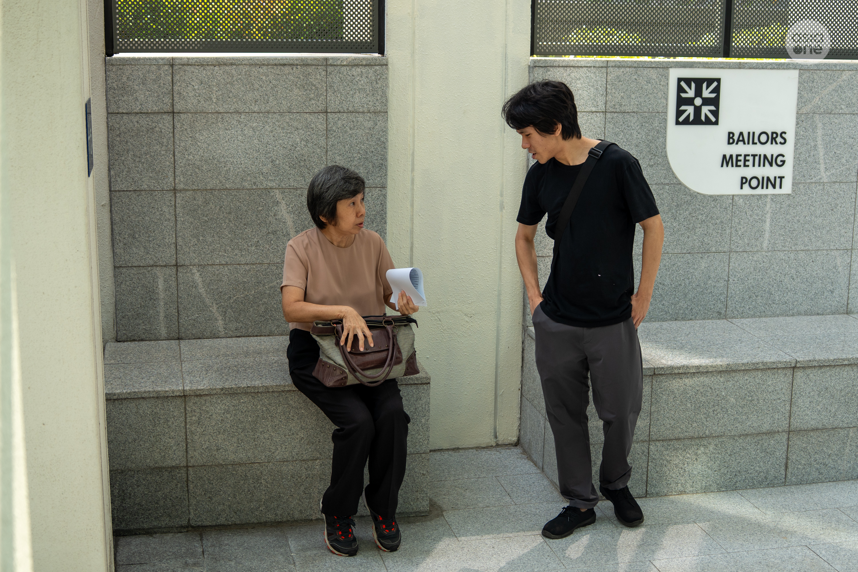 Amos Yee with his mother, Mary Toh, after the court bail of $15,000 was paid.