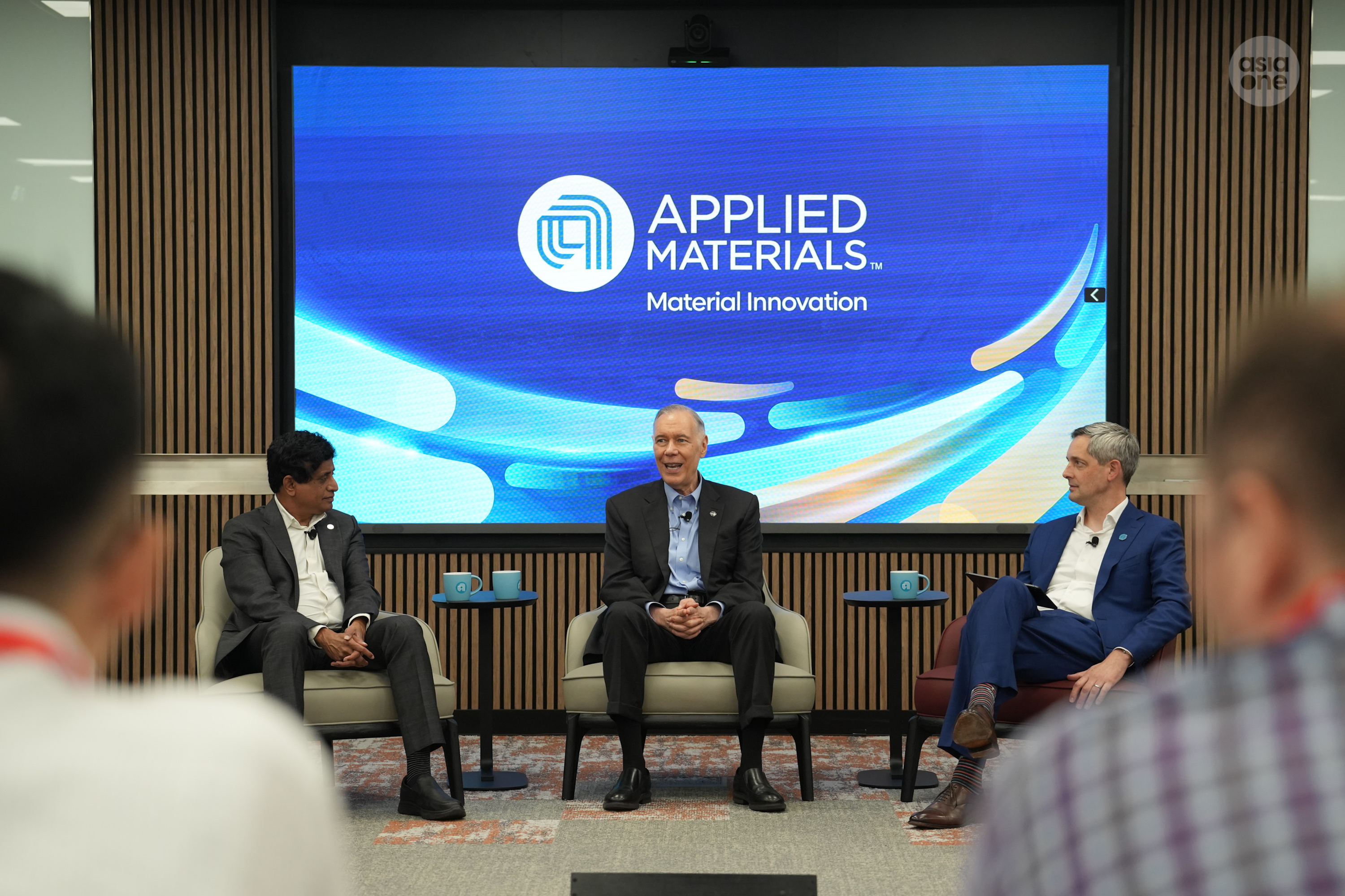President and chief executive officer of Applied Materials Gary Dickerson (middle), flanked by group vice president for corporate strategy Tristan Holtam (right) and president of semiconductor products group Prabu Raja (left).