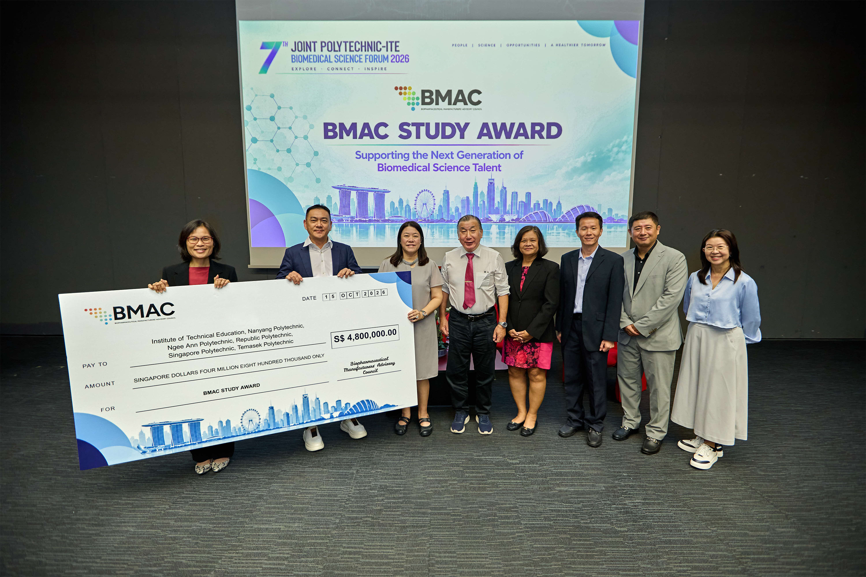 EDB senior vice president and BMAC co-chair Goh Wan Yee (left), and Sanofi Singapore site head and BMAC co-chair Koh Liang Hong, presenting a symbolic cheque to representatives from the polytechnics and ITE. 