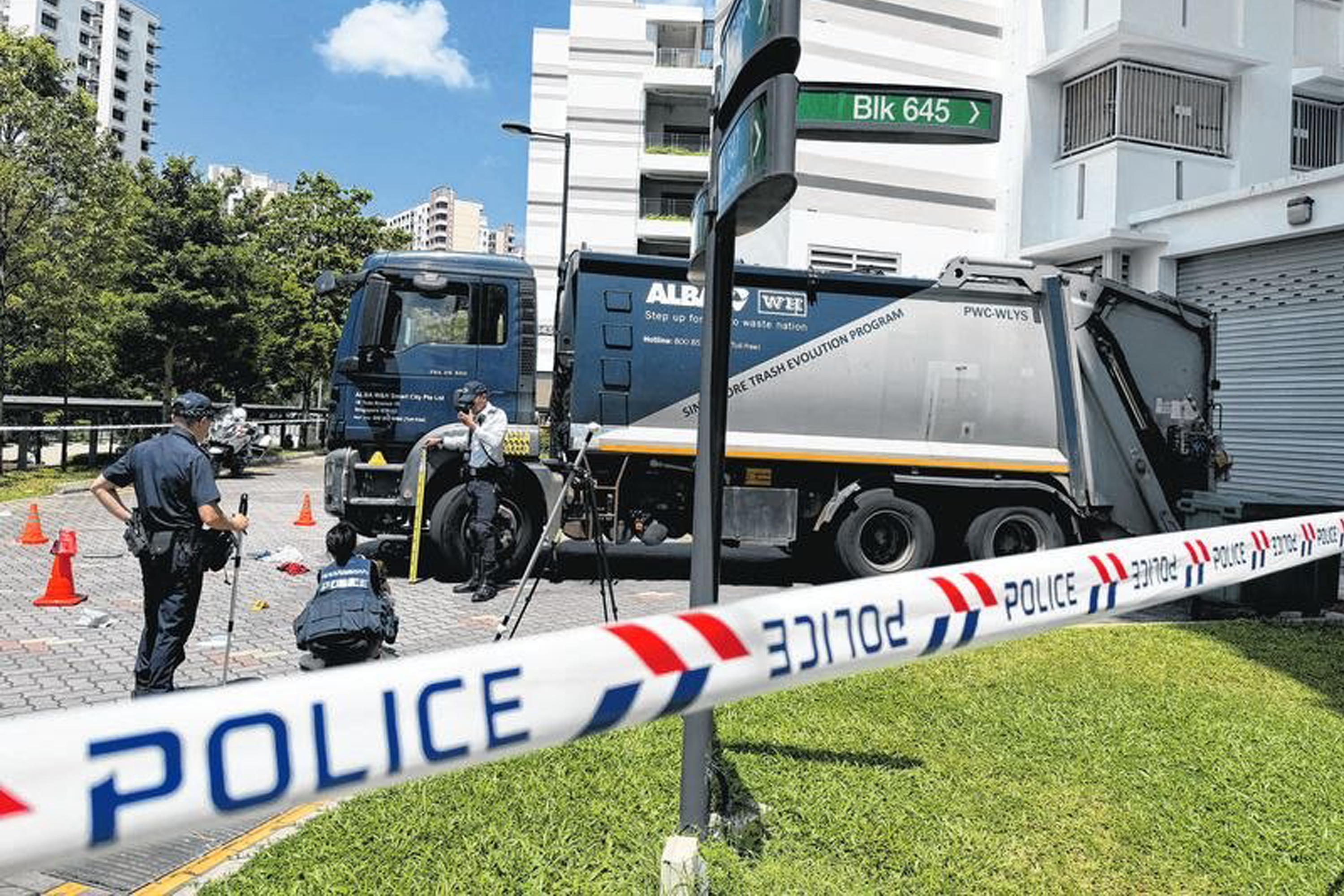 Traffic Police investigators carrying out scene investigation after the accident.