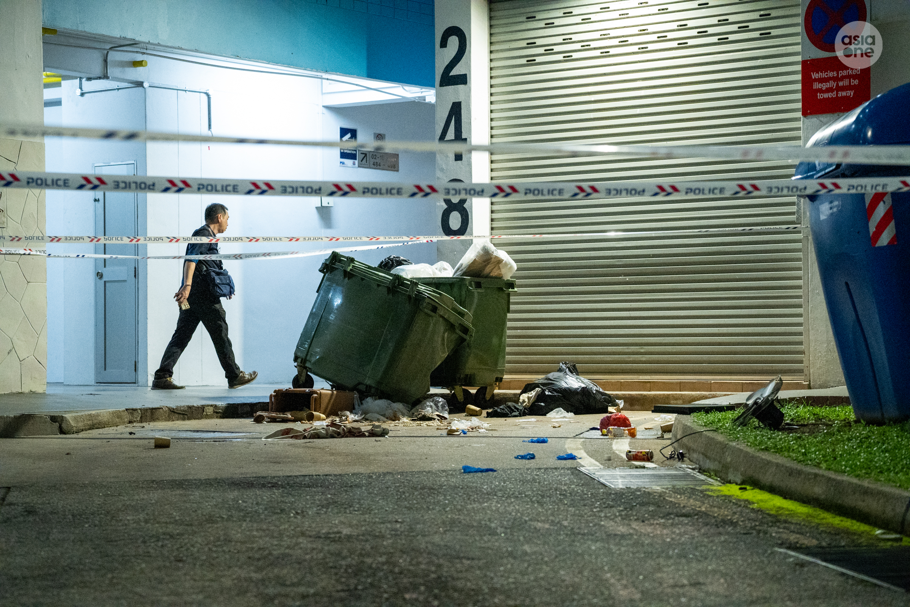 A green dumpster in front of the said block's centralised refused chute, where the man was believed to have landed, was observed to be damaged.