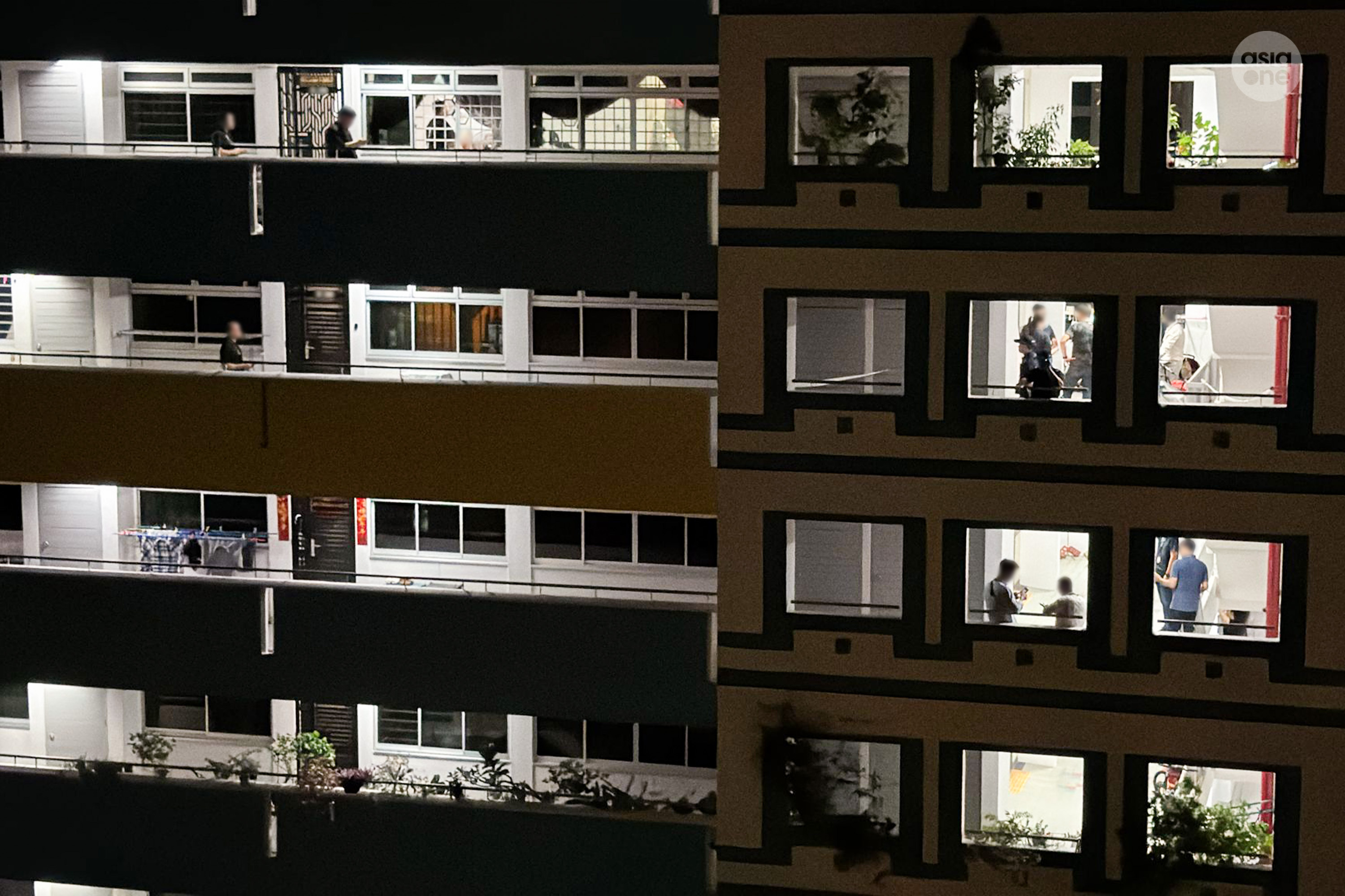 Officers were seen speaking to residents staying on the 12th and 13th floors of the HDB block.