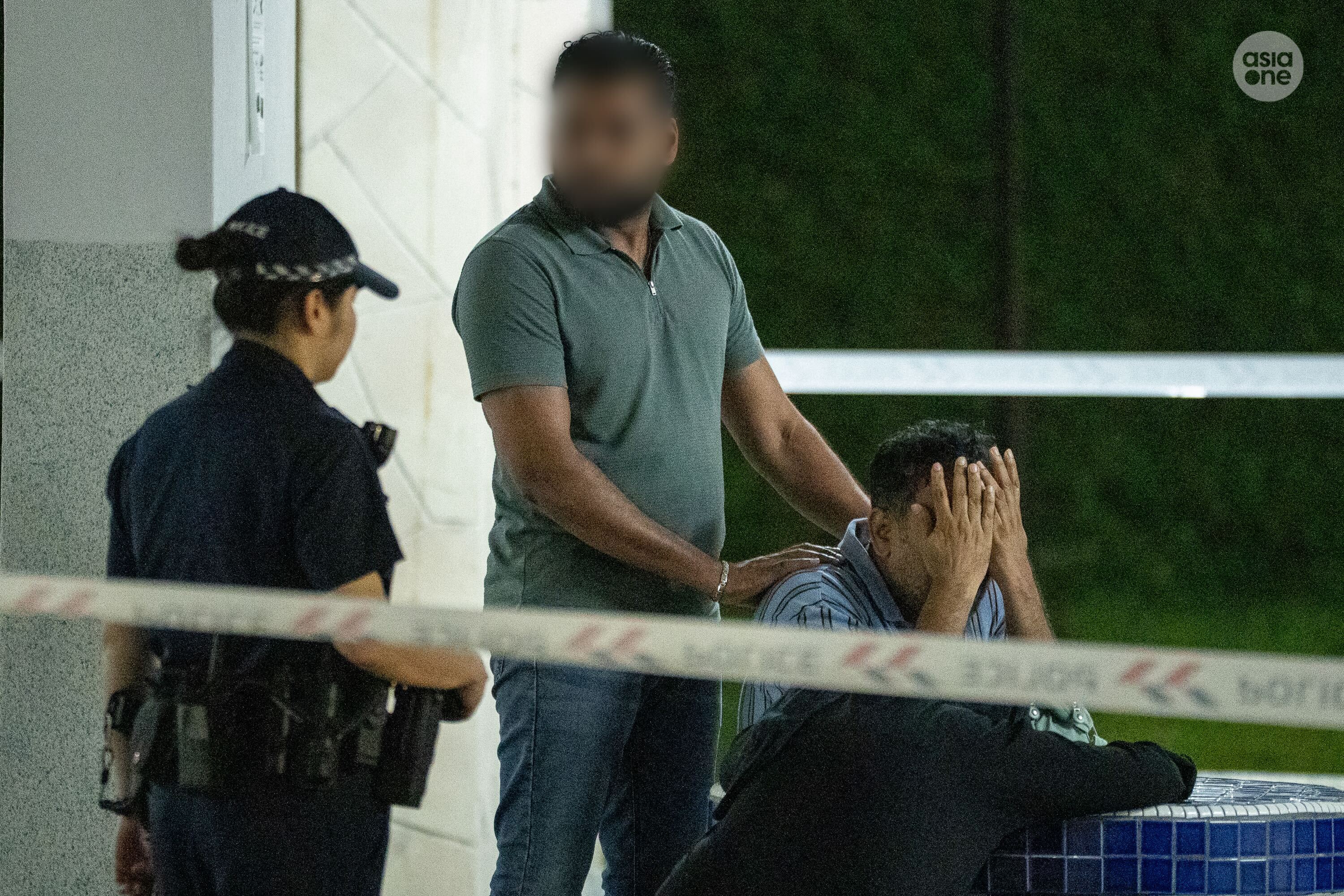 Two persons, believed to be relatives of the alleged assailant were seen at the block's void deck.