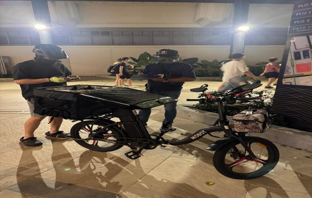 LTA conducting enforcement checks for illegally modified PABs and PMDs in Geylang.