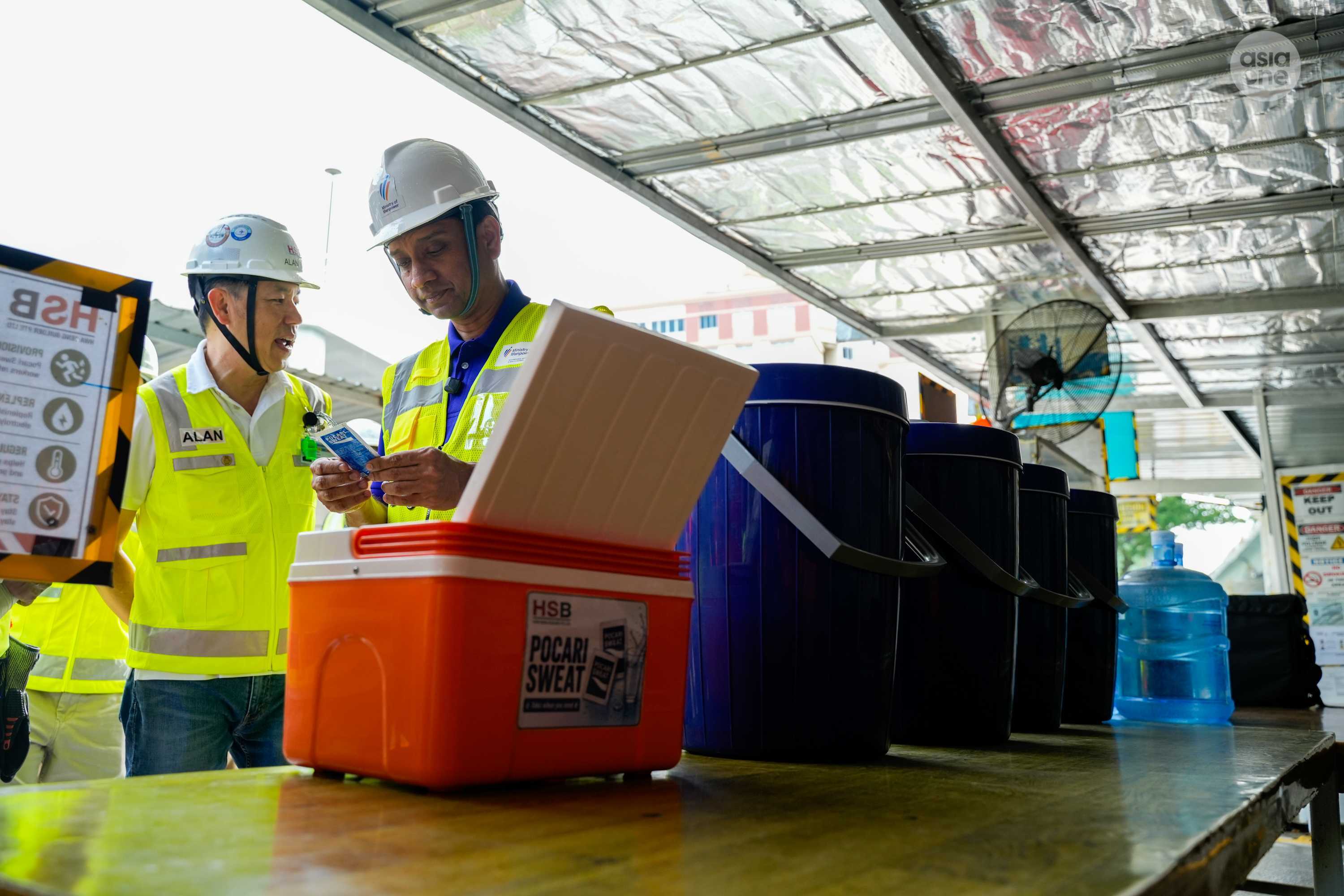 Isotonic drinks and ice are provided for Hwa Seng Builders' workers to help them in replenishing salts and to stay cool and hydrated.