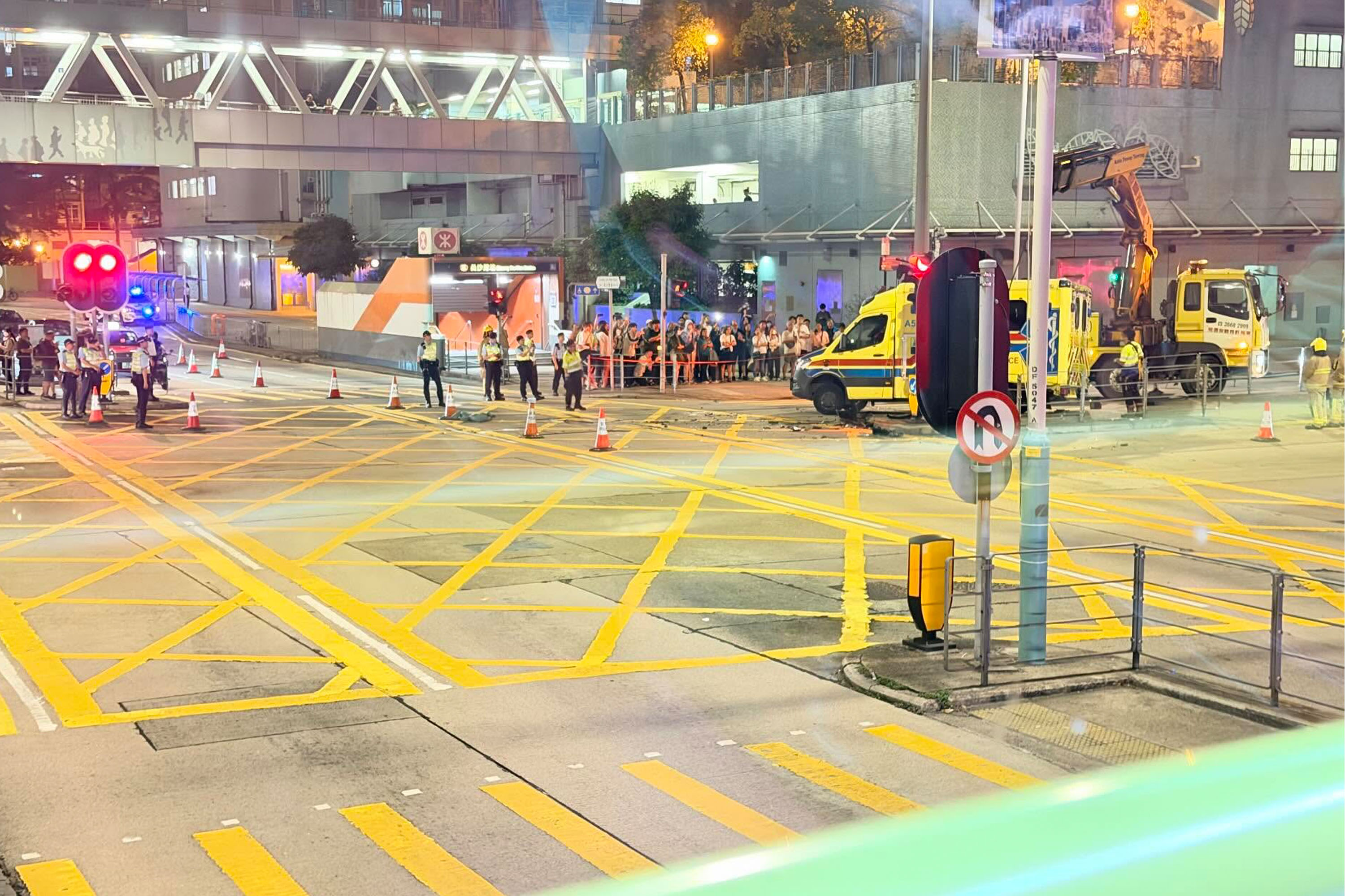 The damaged ambulance had to be lifted upright by a lorry crane.