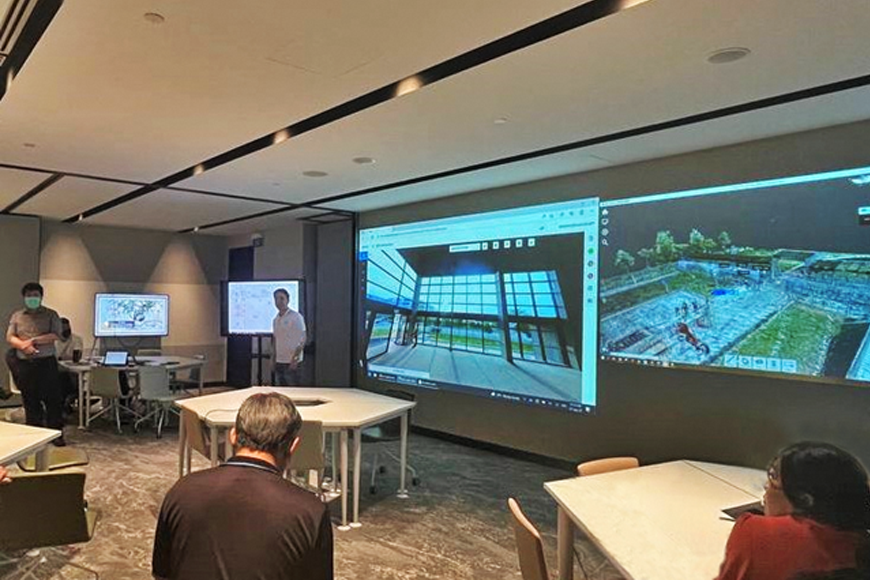 A virtual TOP inspection session in progress at JTC semiconSpace with screen (left) showing a 360-degree photo of the building and screen (right) showing its point cloud data.