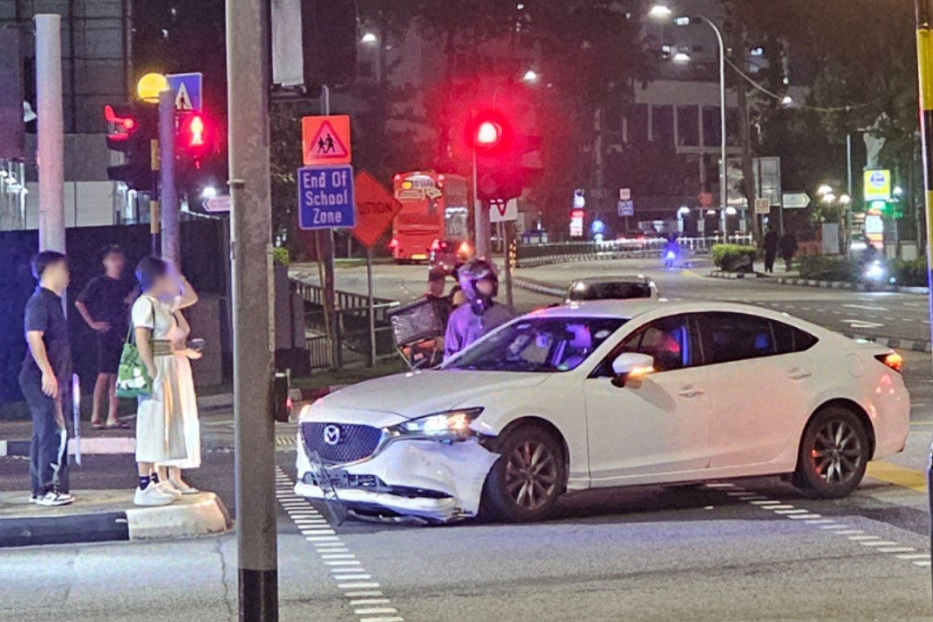  The Mazda 6 sedan's front bumper was seen partially dislodged.