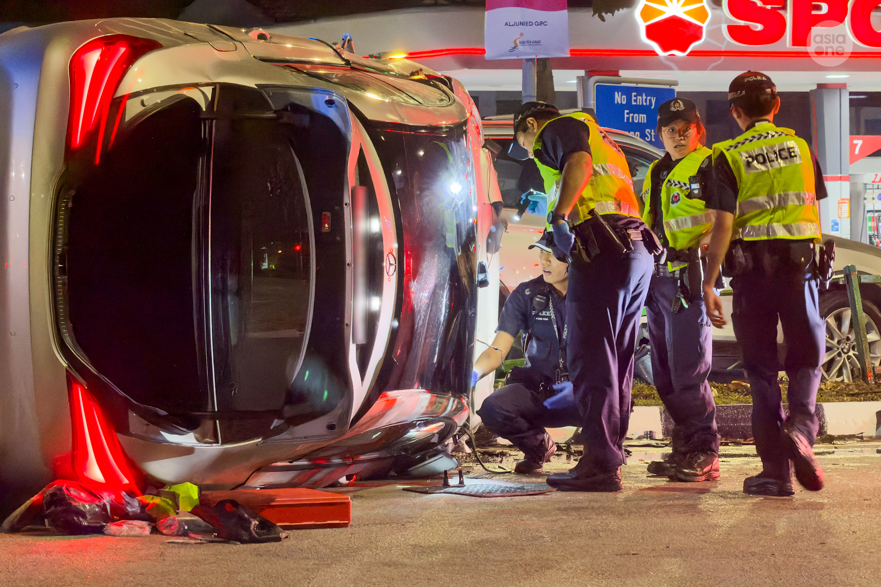 Police officers searching the vehicle after a vaporiser was found in his possession.