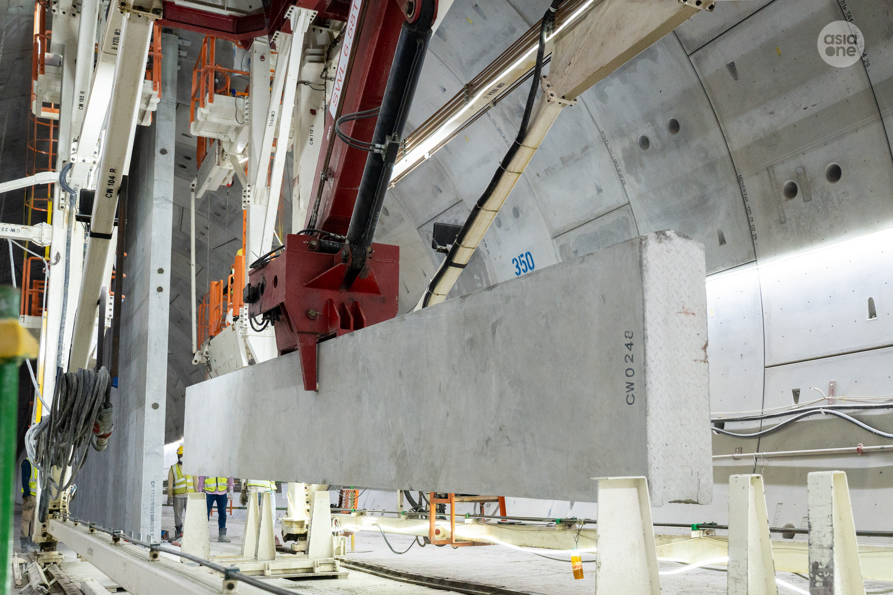 A specially designed erection gantry equipped with a robotic arm will be used to handle, position, and install the precast centre wall panels.