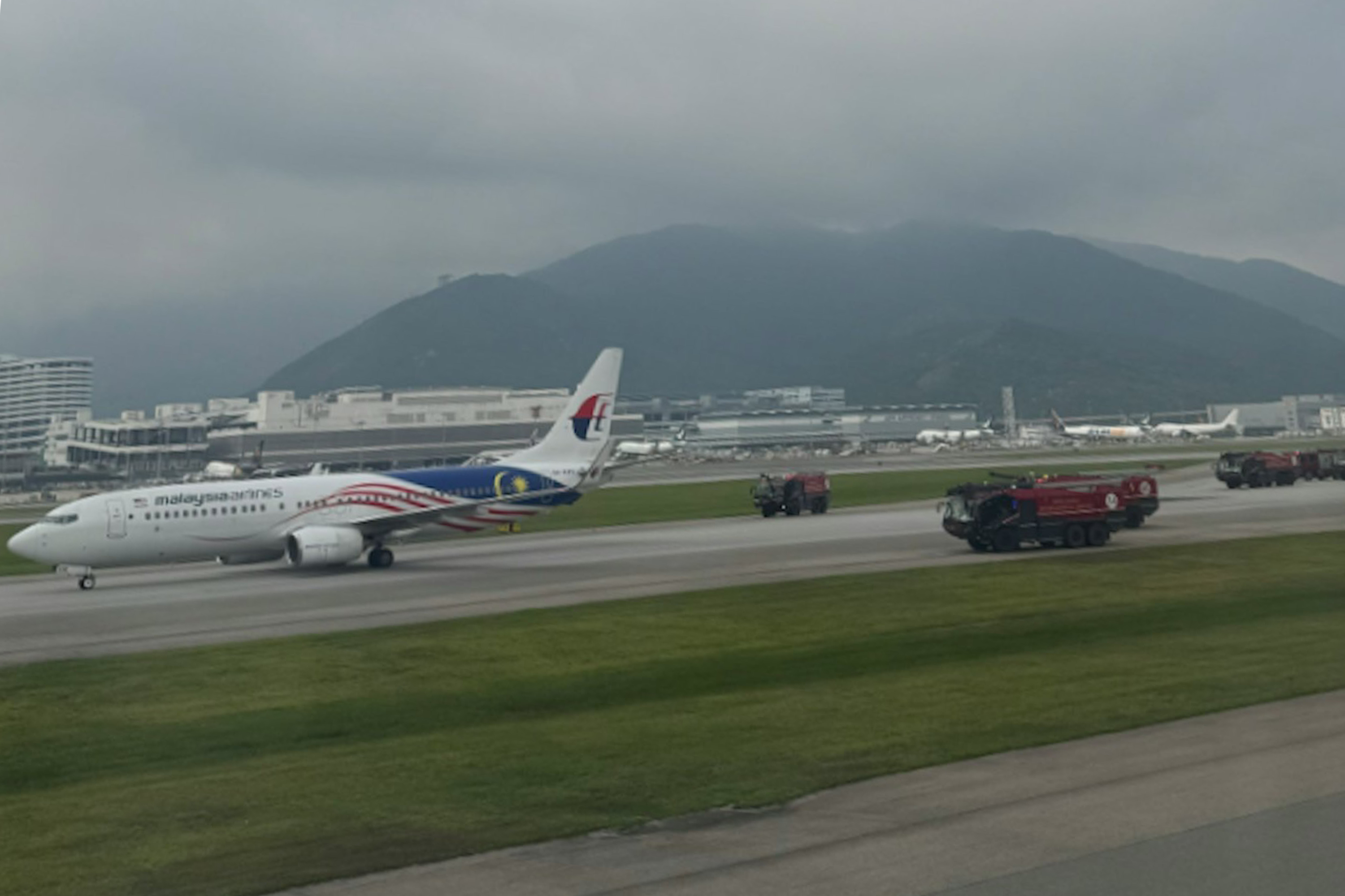 Emergency services vehicles were seen around Malaysia Airlines flight MH079.