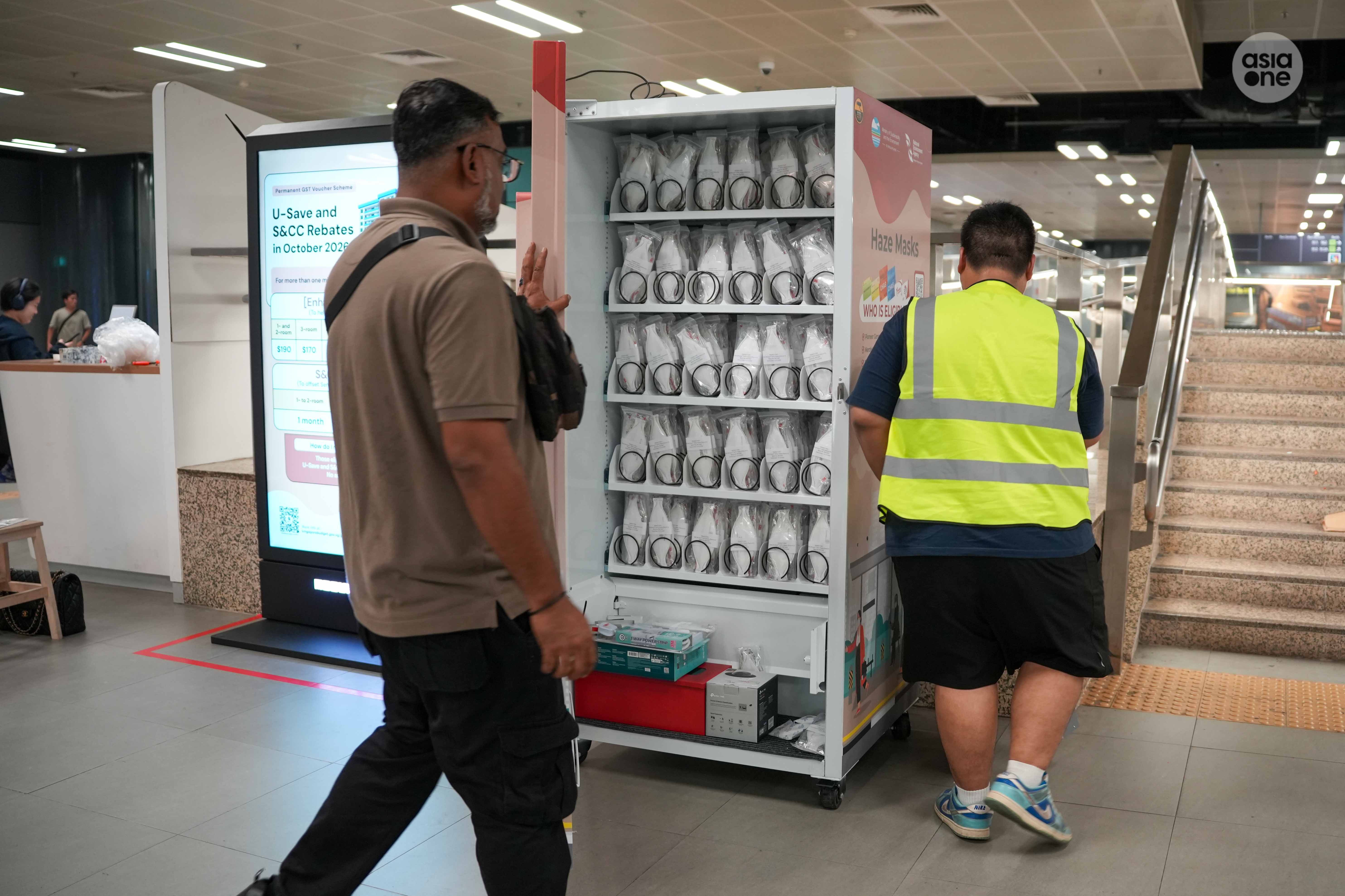 At Woodlands Integrated Transport Hub on Wednesday (Oct 17) evening, works are underway to get the mask vending machine operational.