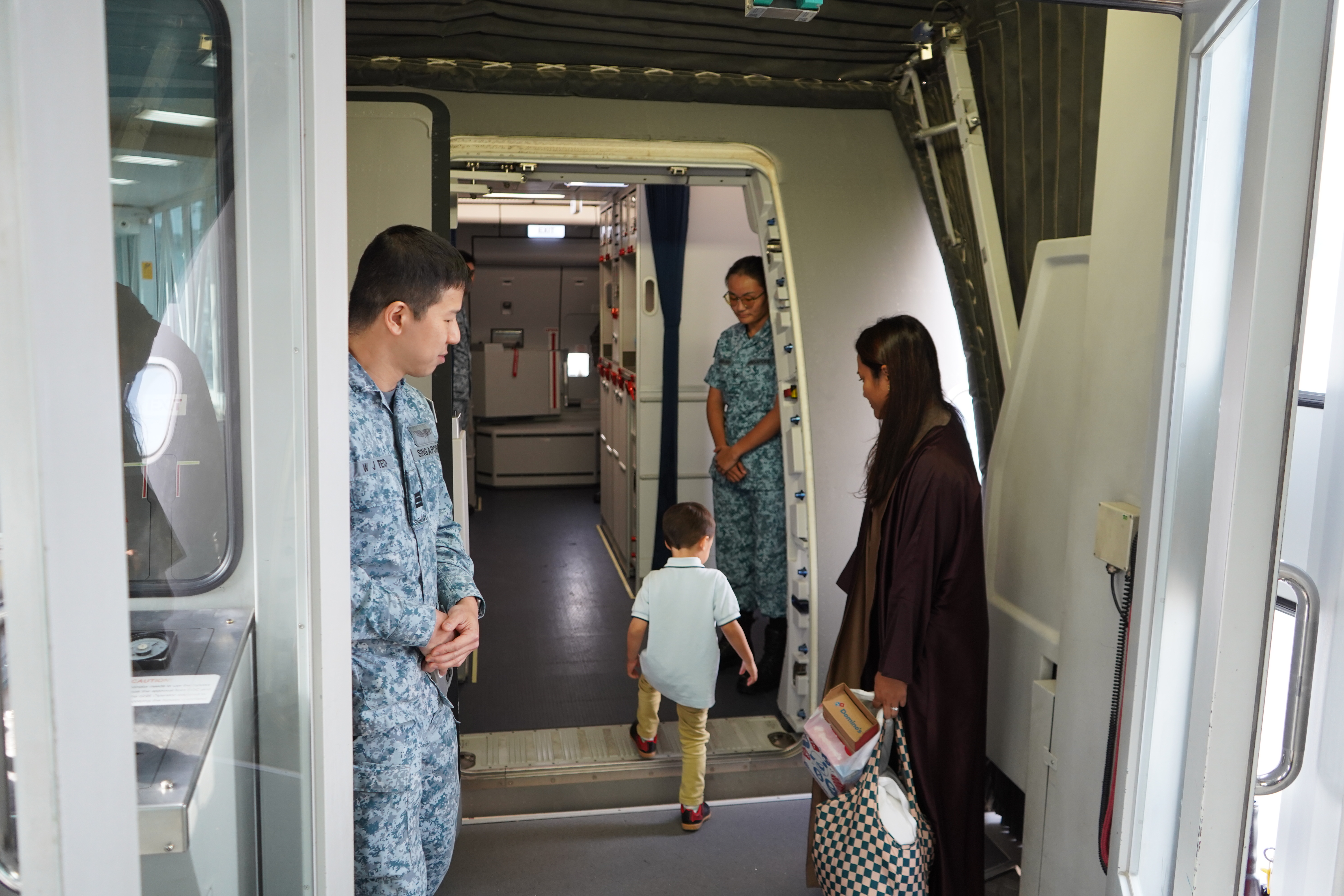 Not flight stewards or stewardesses, but RSAF personnel tried to give the passengers a familiar experience.