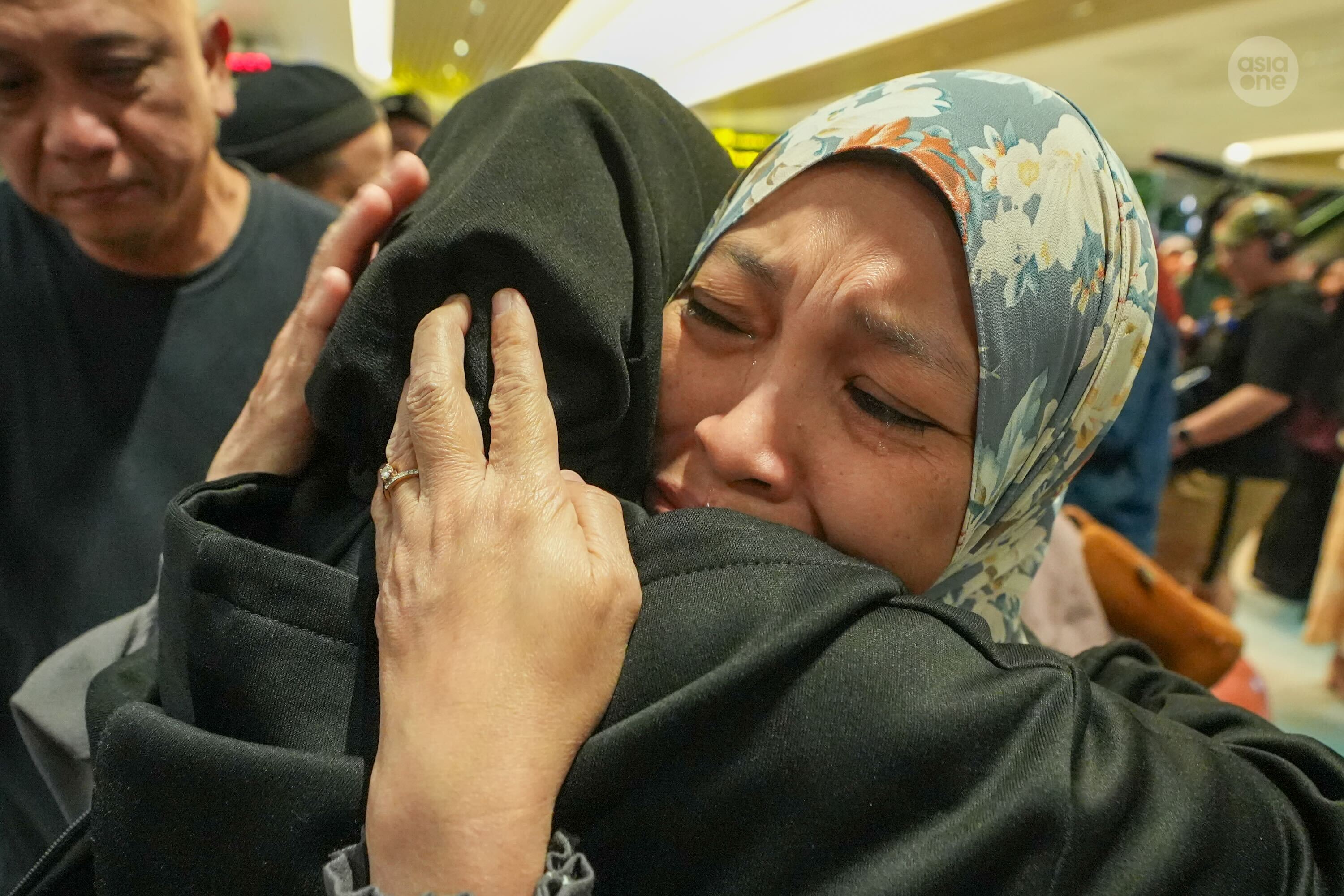 Tears flowed as Rozana Binte Khamsen held her daughter in her arms again.