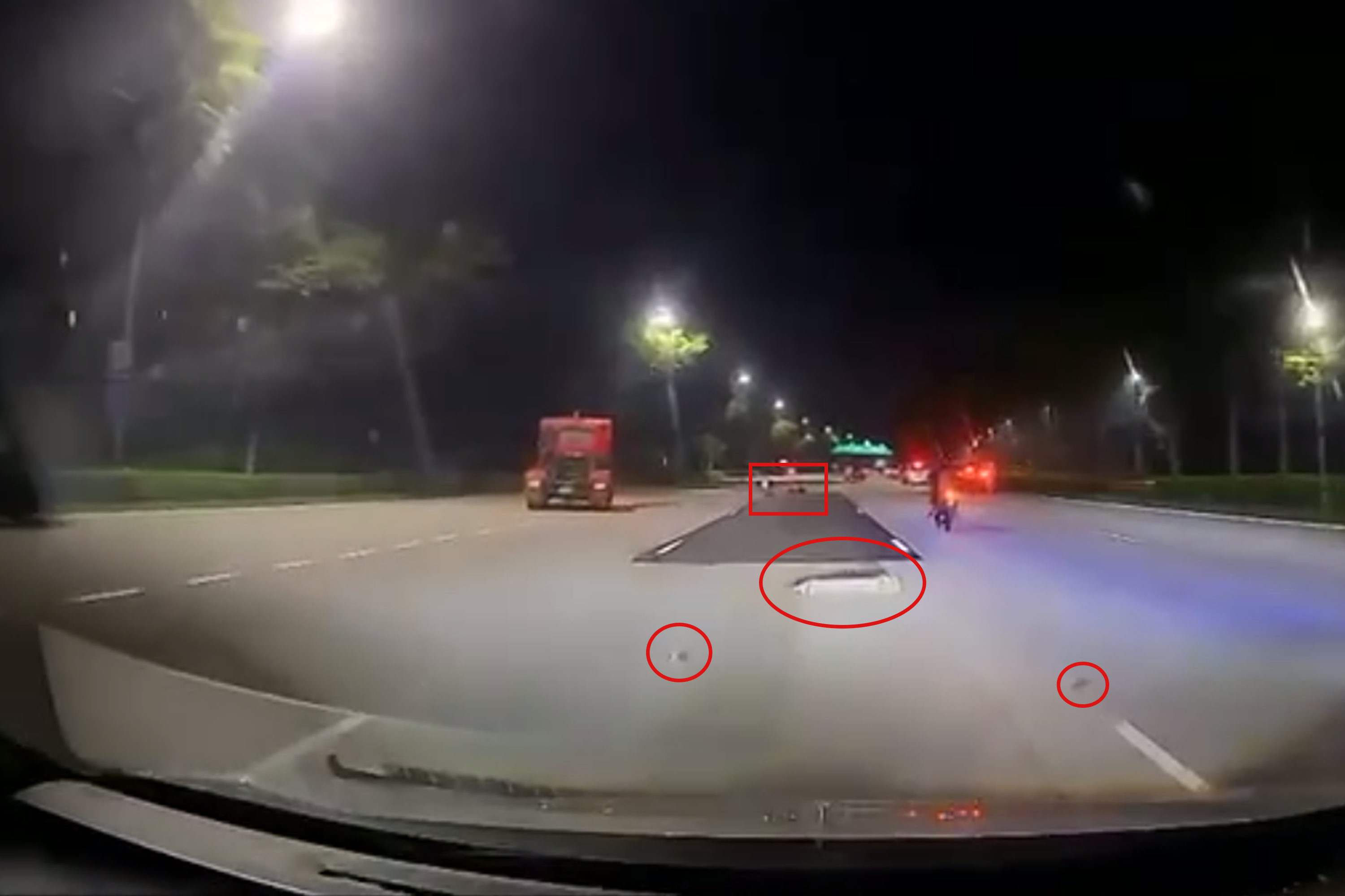 The fallen objects are marked with a circle. The motorcyclist is marked with a box.