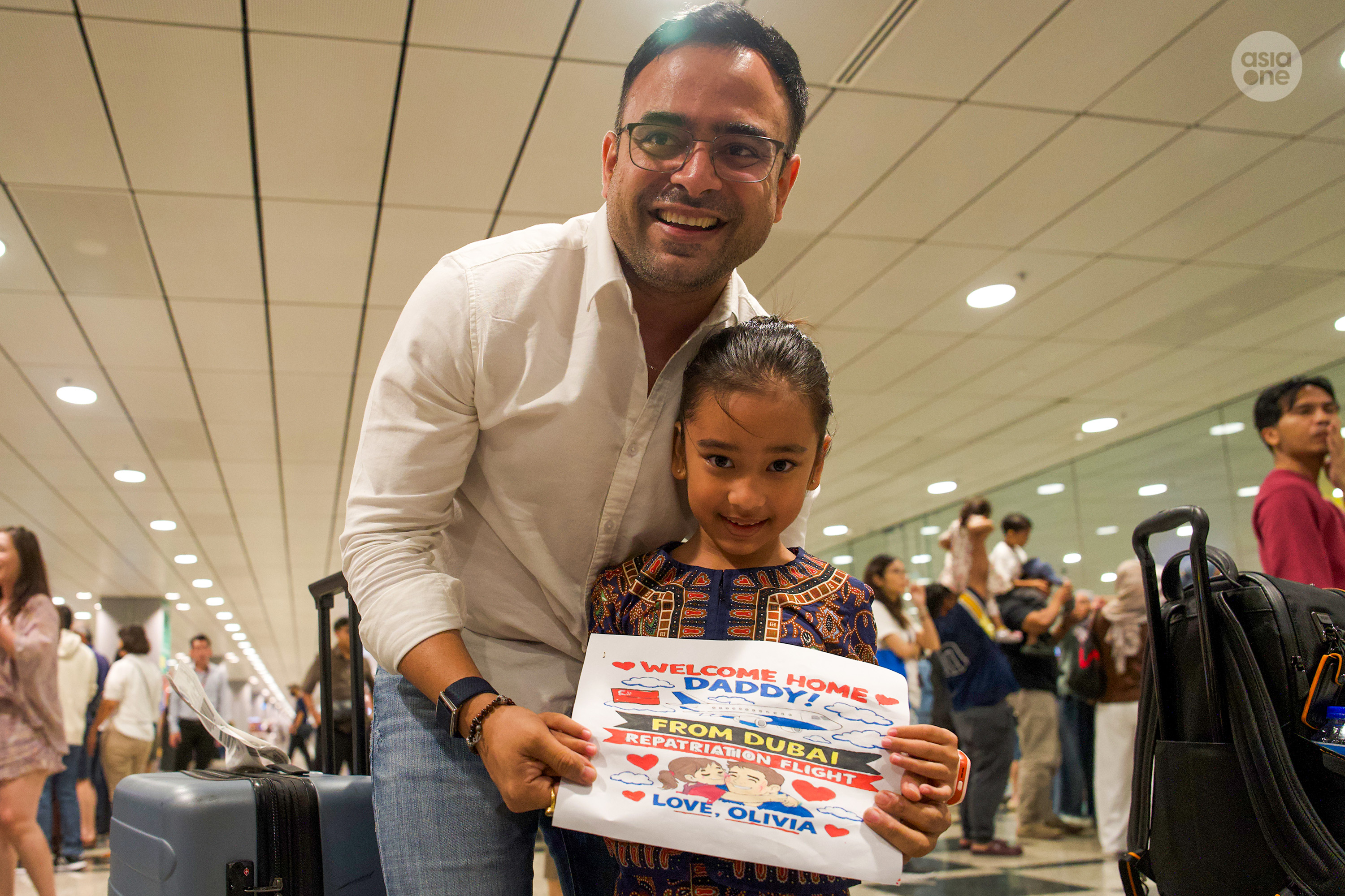Varun Seth, 40, reuniting with his daughter at Changi Airport Terminal 3 on Saturday (March 7) night.
