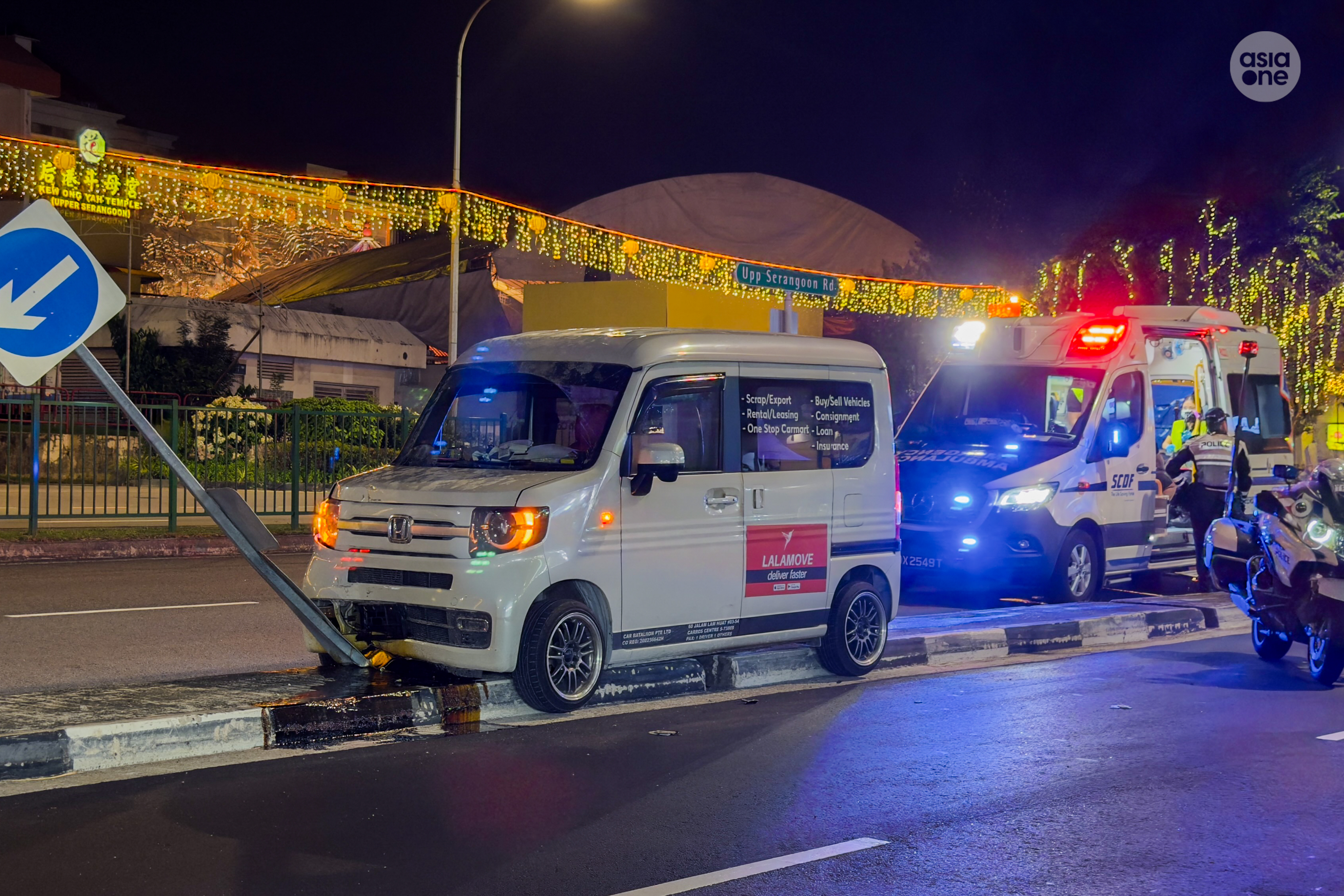 The van mounted the road divider and crashed into a road sign. Engine oil was seen leaking from below the front bonnet of the rental Honda N-Van.  