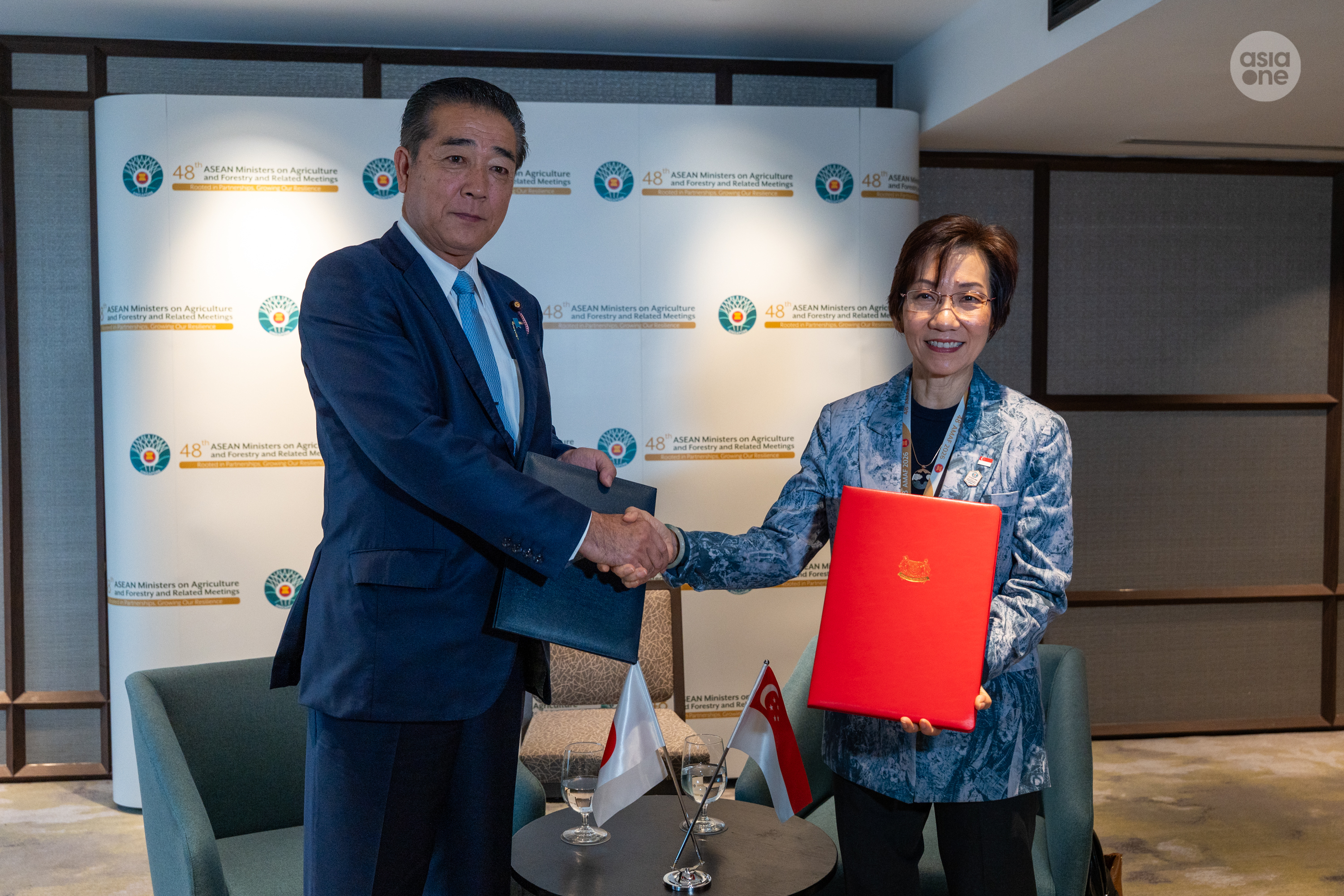 Sustainability and the Environment Minister Grace Fu and Japan's State Minister of Agriculture, Forestry and Fisheries, Fujiki Shinya, exchanging the renewed memorandum of cooperation in the agriculture and food sector on Oct 29.