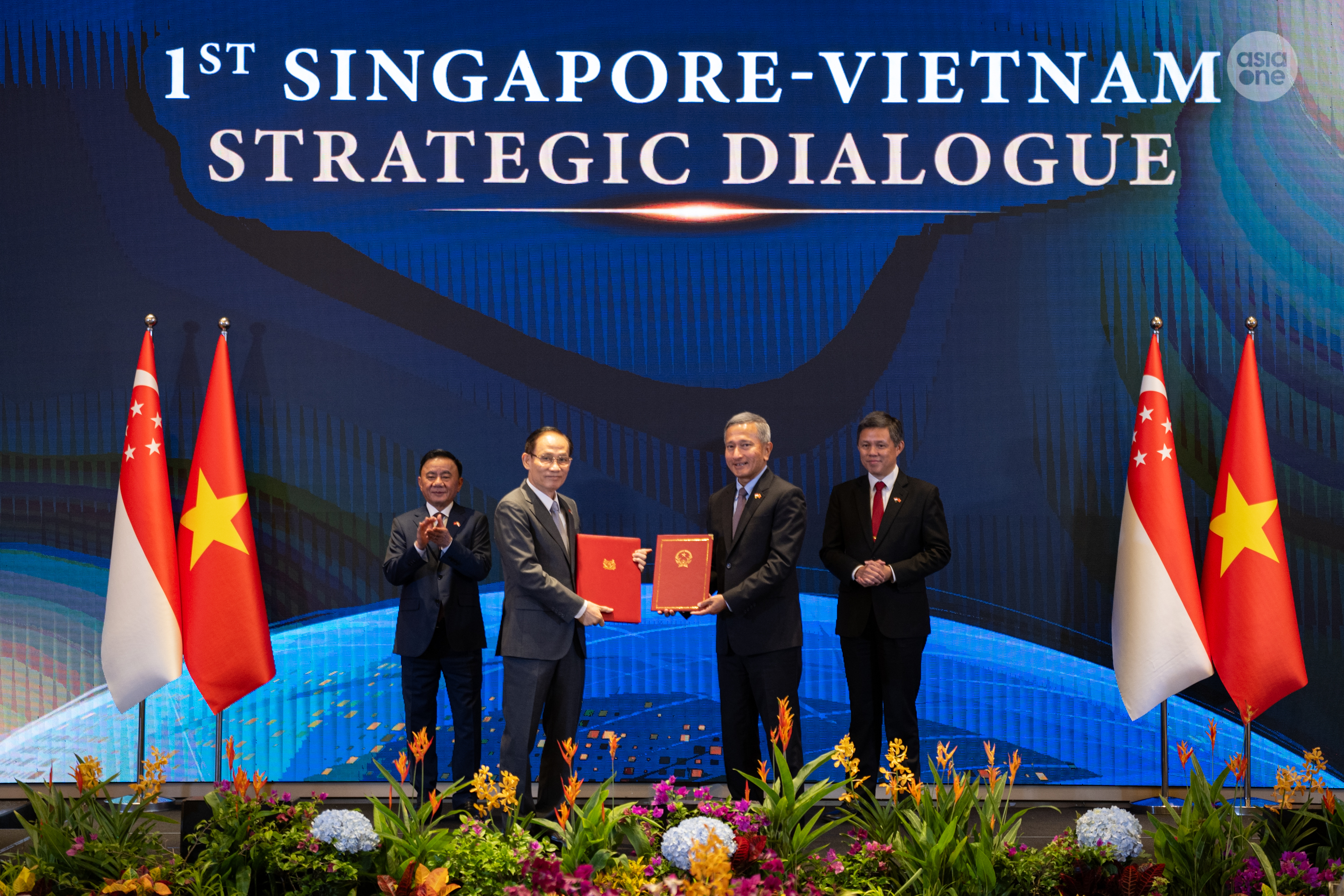 Singapore's Minister for Foreign Affairs Dr Vivian Balakrishnan (right) and his Vietnamese counterpart Le Hoai Trung reviewed the agreement on a joint study visit progamme at the dialogue.
