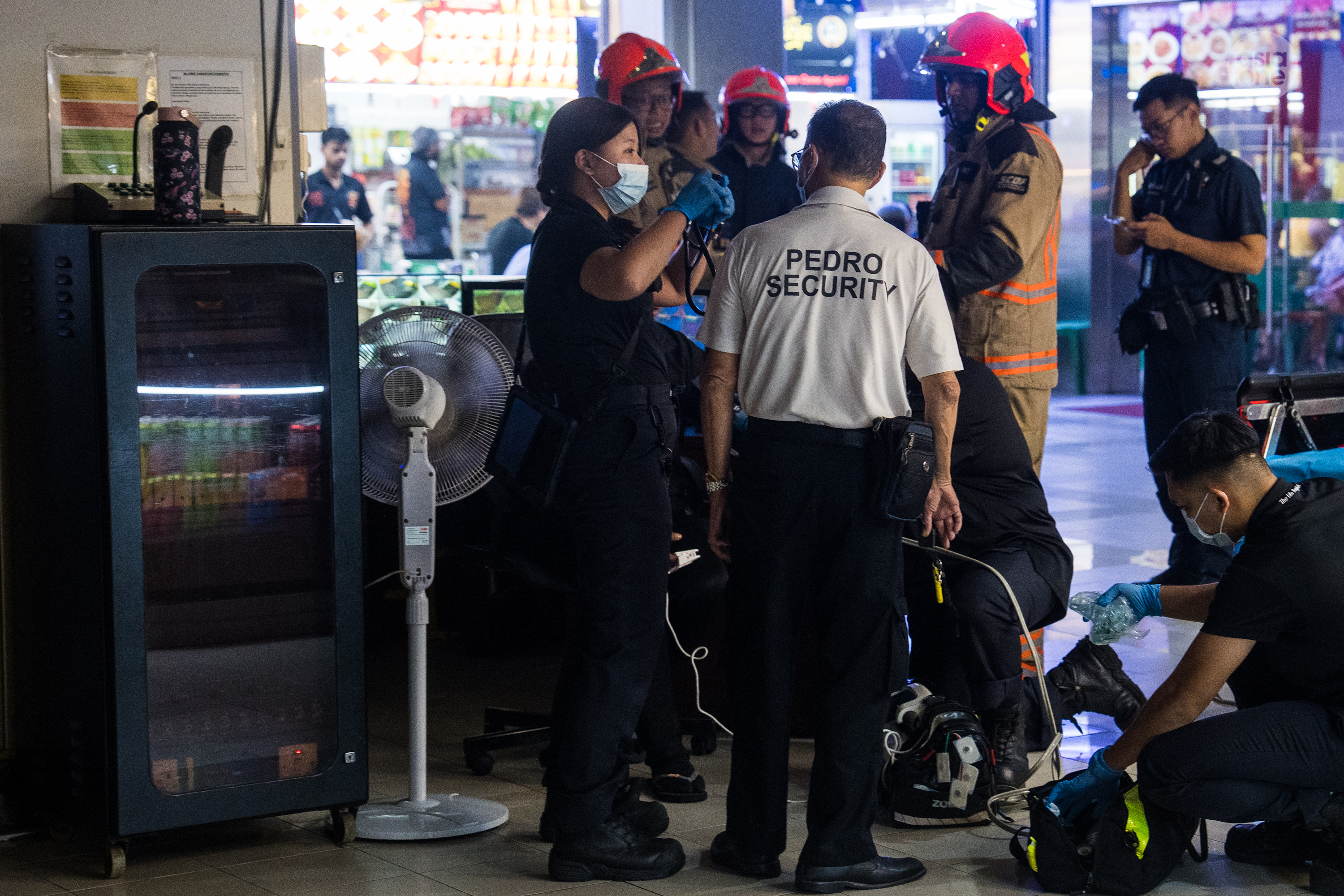 SCDF paramedics assessing a person outside Sultan Plaza on Friday (Aug 28) night.