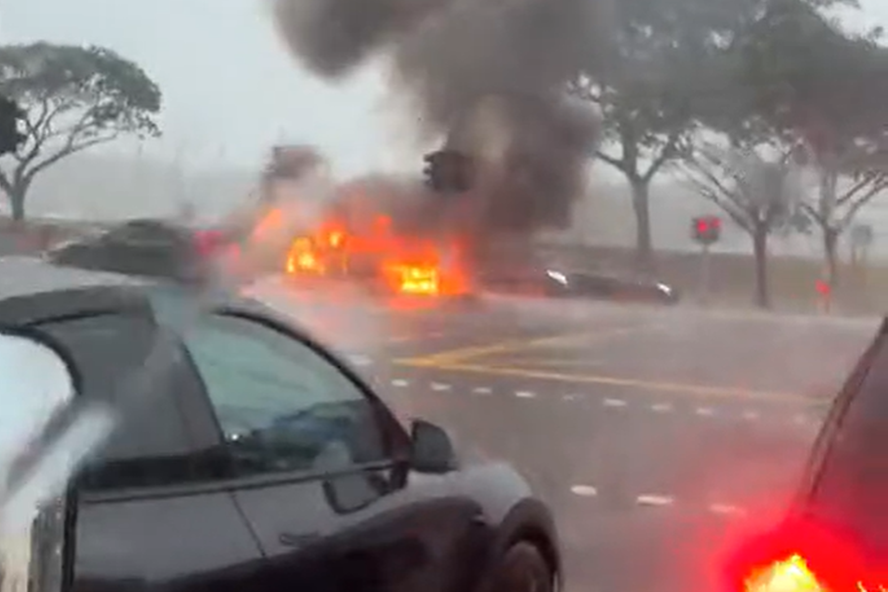 The car was later seen totally engulfed by flames.