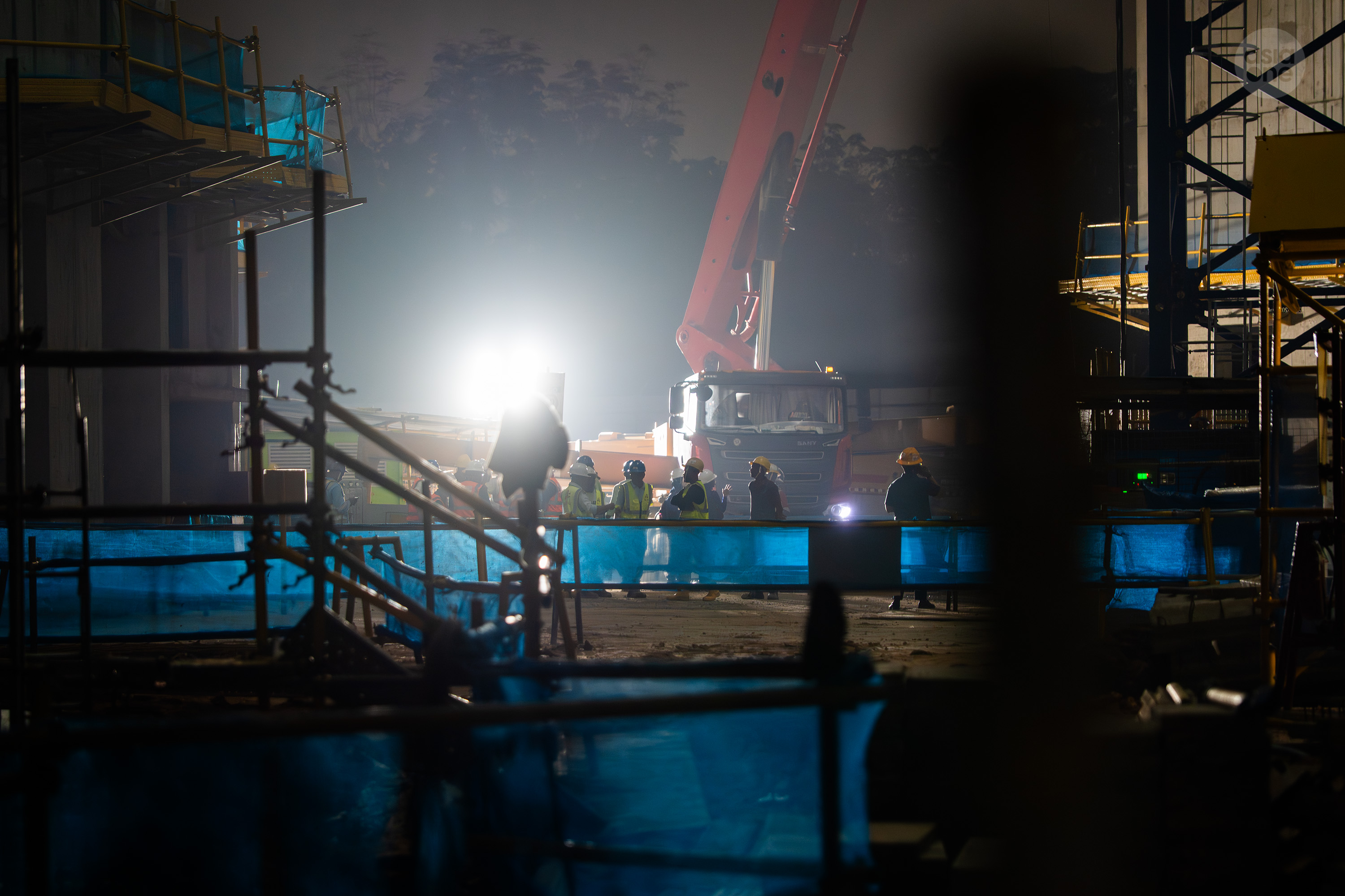 Investigators seen near the concrete pump truck involved in the incident at 8.20pm on Sept 28.