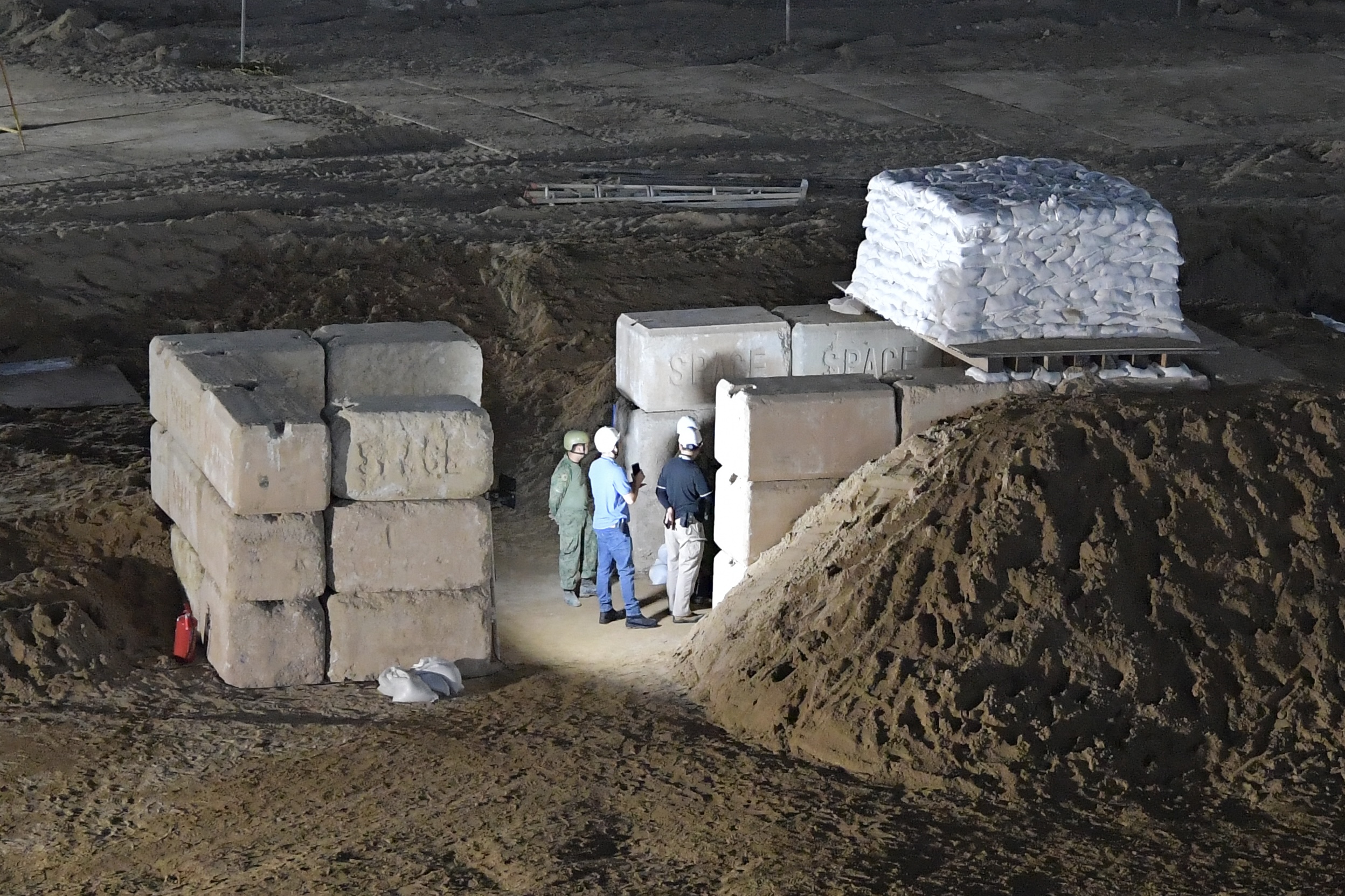 Protective works constructive around the unexploded ordnance.
