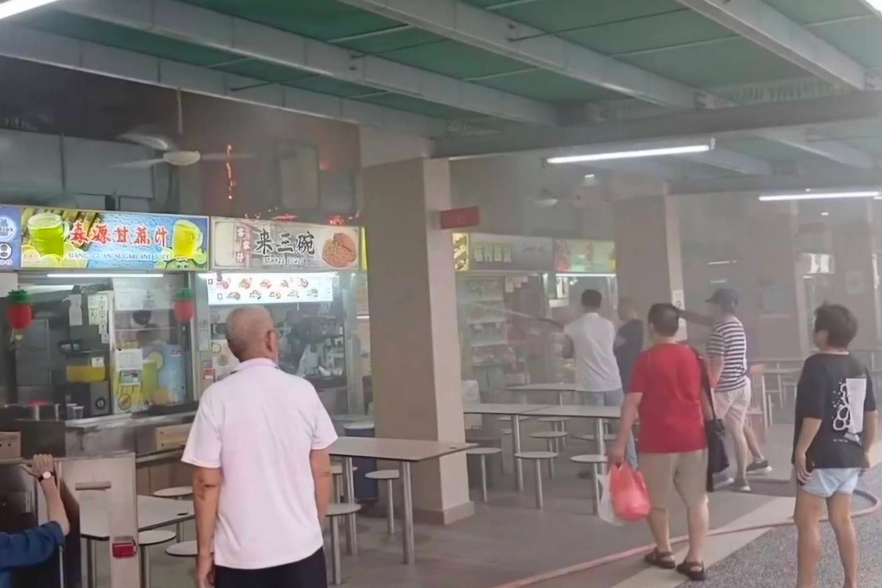 At least two passers-by stepped forward to help. They were seen using a hose reel to douse the flames.