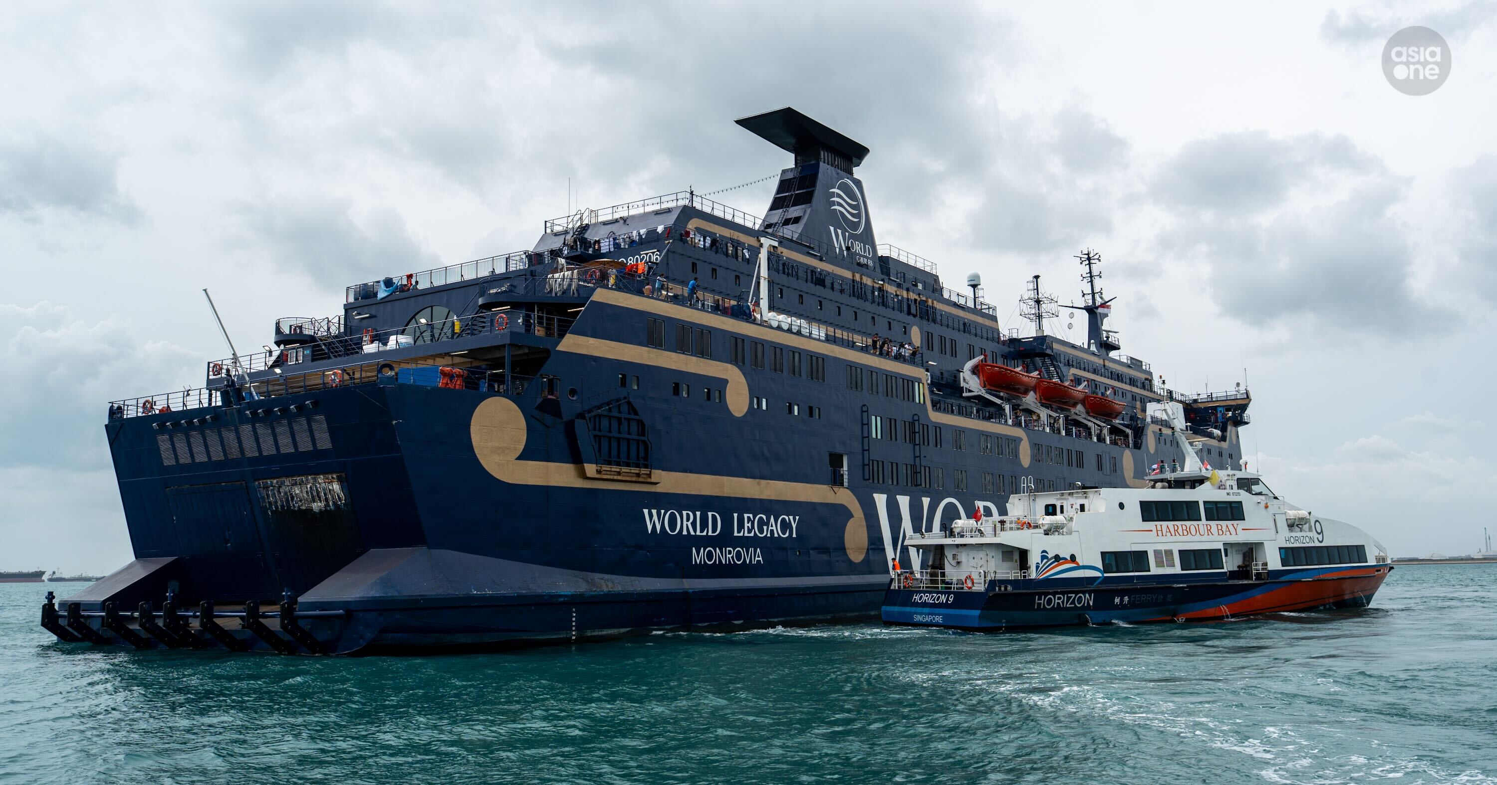 A ferry coming alongside World Legacy at 4.15pm to disembark non-essential crew.