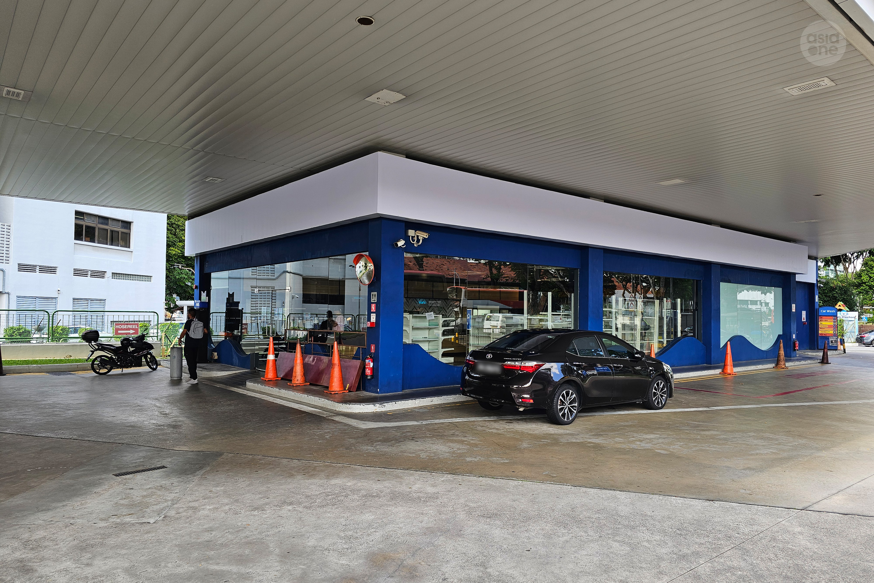 At Esso's petrol kiosks across Singapore, FairPrice Xpress's signages are being removed. 