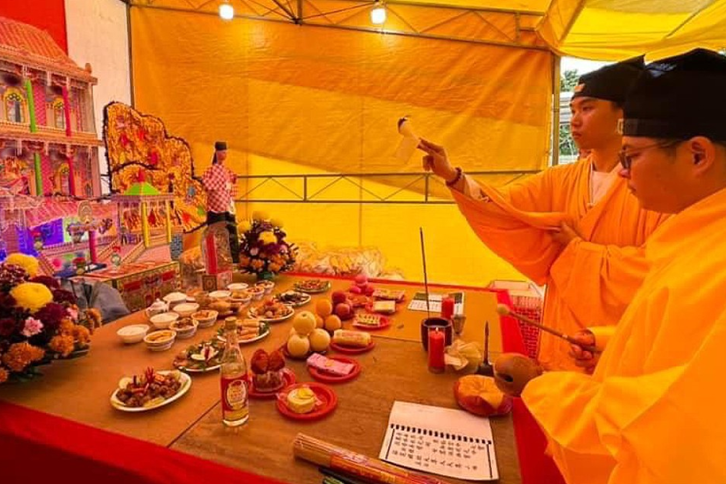 Taoist priests conducting rituals to help devotees pray for forgiveness, as well as happiness and the avoidance of disasters.