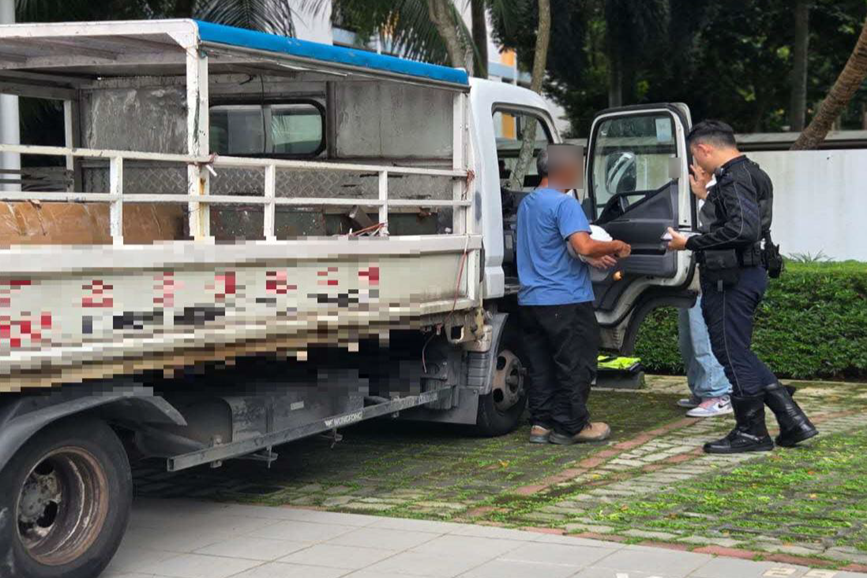 A traffic police officer conducting checks on speed limiter installation during the two-day enforcement blitz.