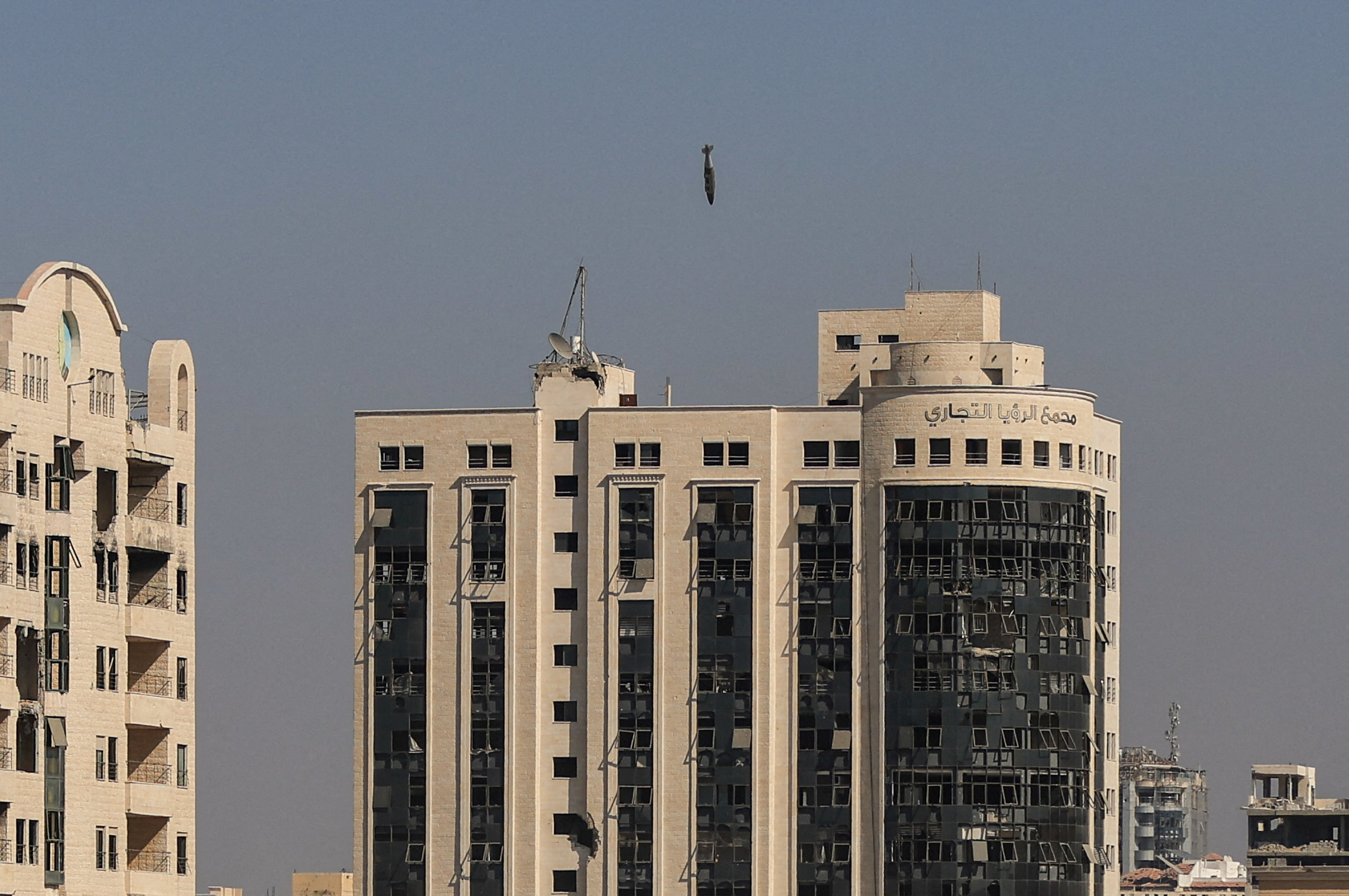 A missile falls towards a building during an Israeli airstrike in Gaza City, on Sept 8.