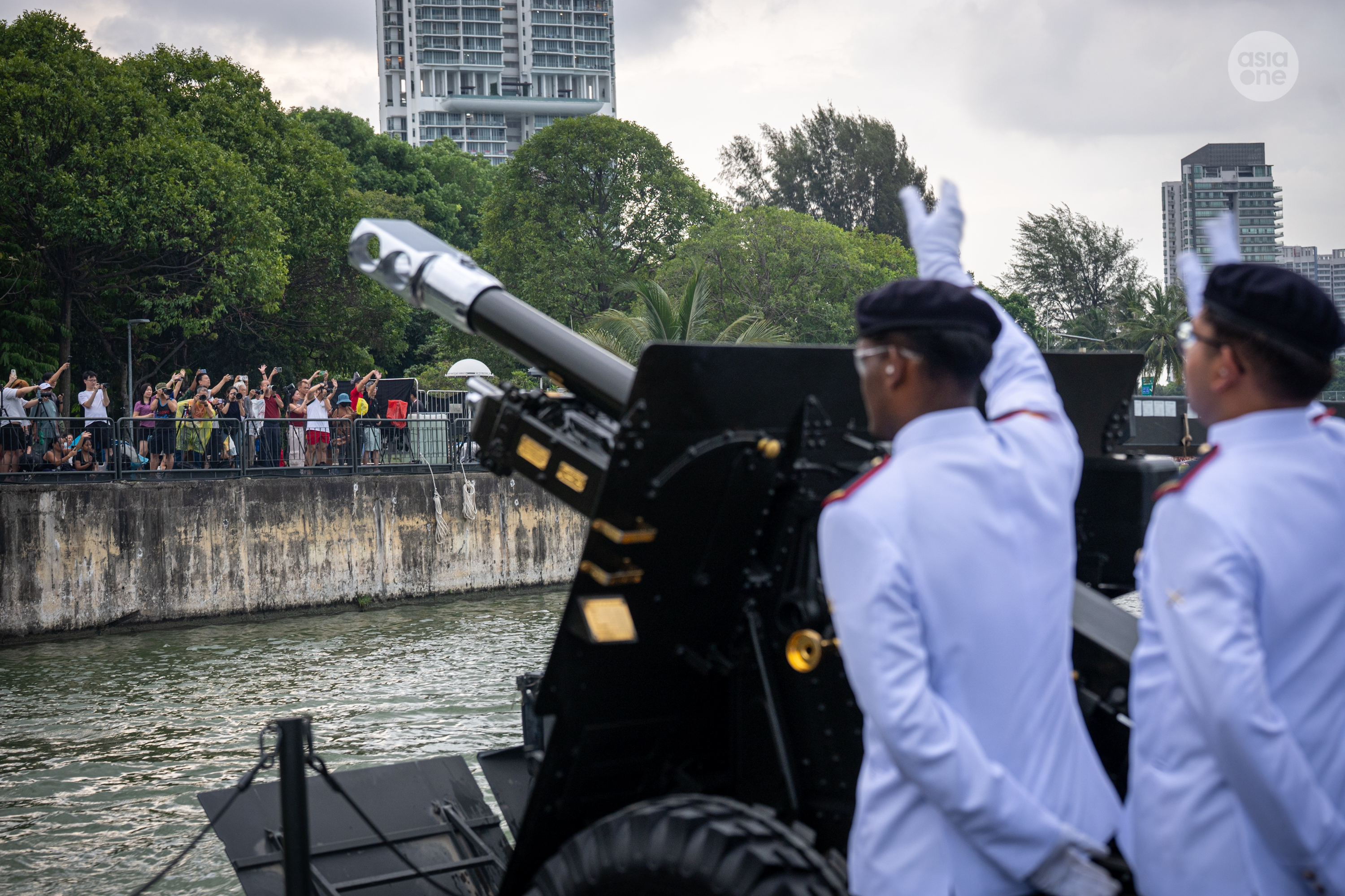 PGS crew members waving to members of the public at the riverfront.
