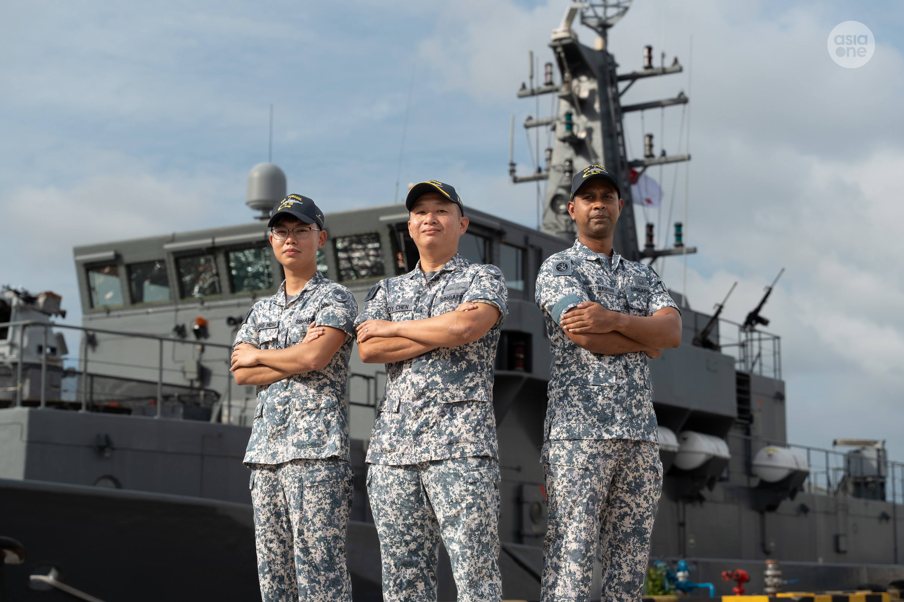 Mine Countermeasure Vessel RSS Punggol is the navy's best maritime security unit. Pictured in the middle is the ship's commanding officer, Major Cai Qinghe.