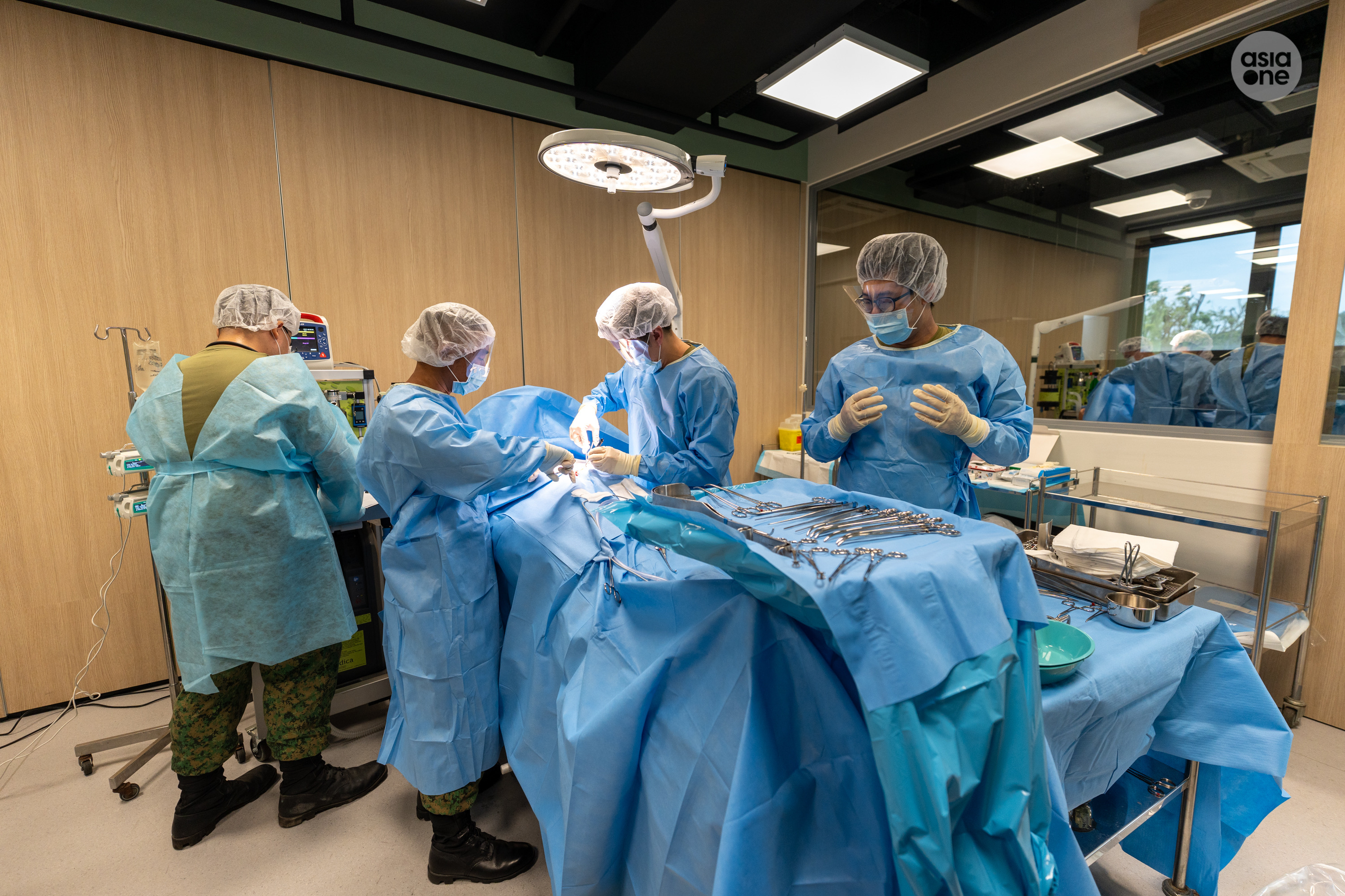 LTC (NS) Dr Wayne Yap and his team honing their skills at the SAF Medical Training Institute in Nee Soon Camp.
