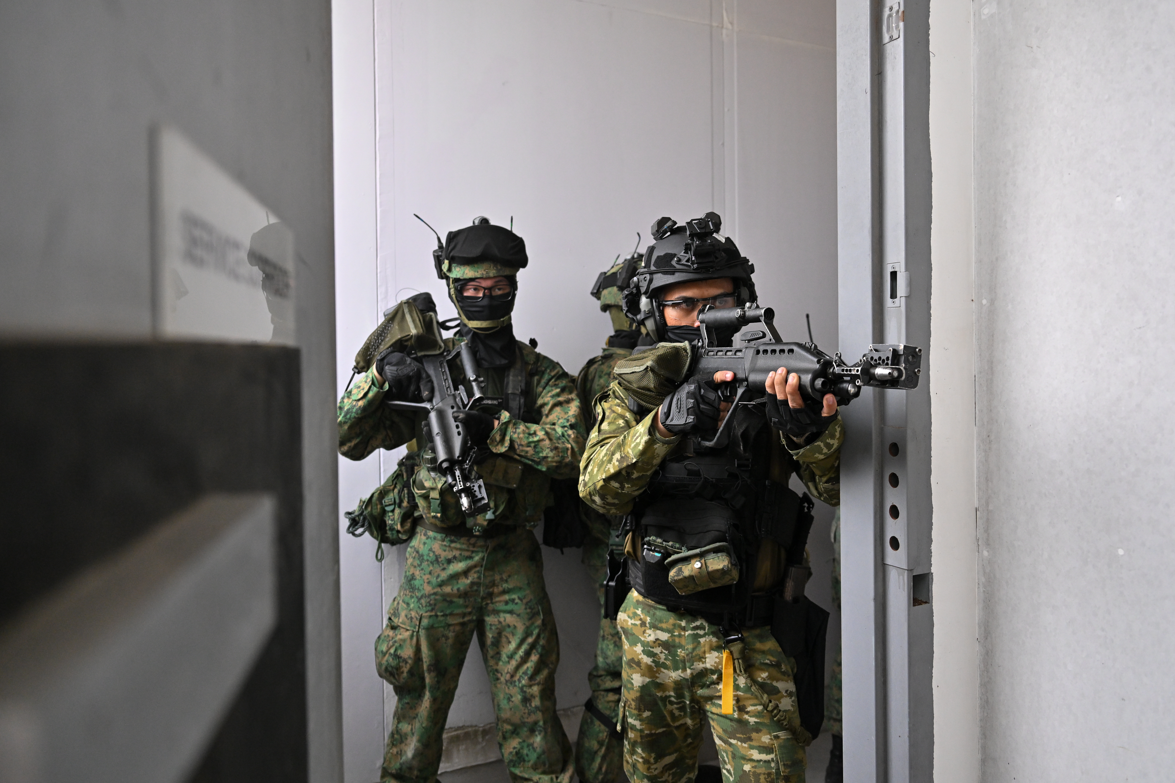 Troops from the Singapore Army and the TNI's Special Forces Command conducting close quarter battle training during Exercise Chandrapura.