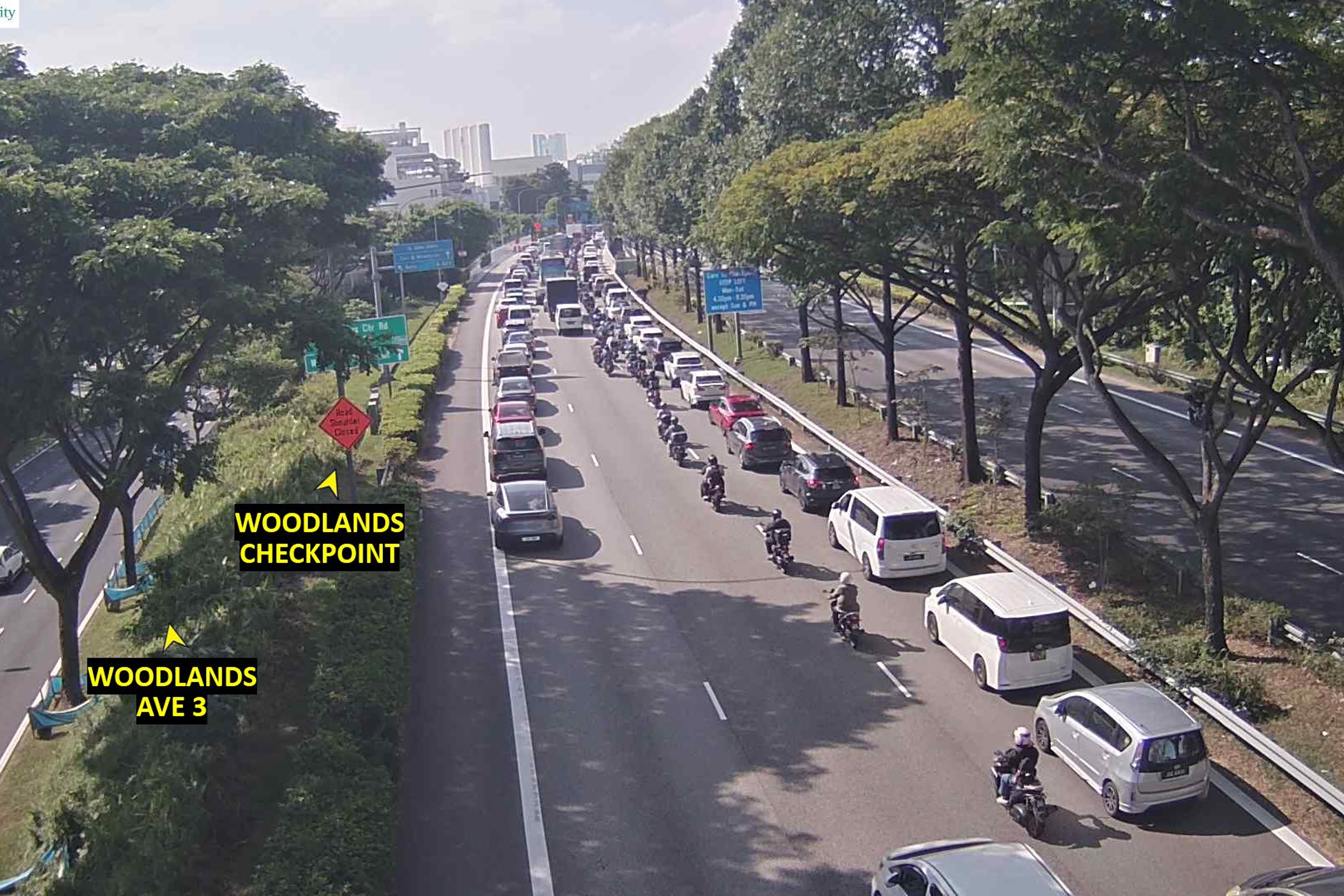 Checks on the Land Transport Authority's traffic cameras at 4.20pm indicate that the car queue has extended past Woodlands Avenue 3, Exit 10B.