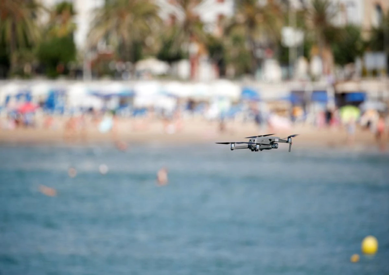 As Spain's beaches fill up, a seaside resort sends in the drones, World ...