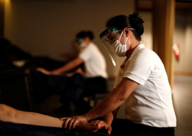 Thais head for movies and massage as virus lockdown eases, Asia News