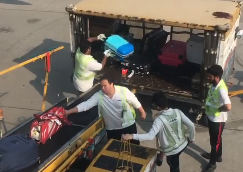 Hong Kong airport apologises after staff filmed throwing luggage, Asia